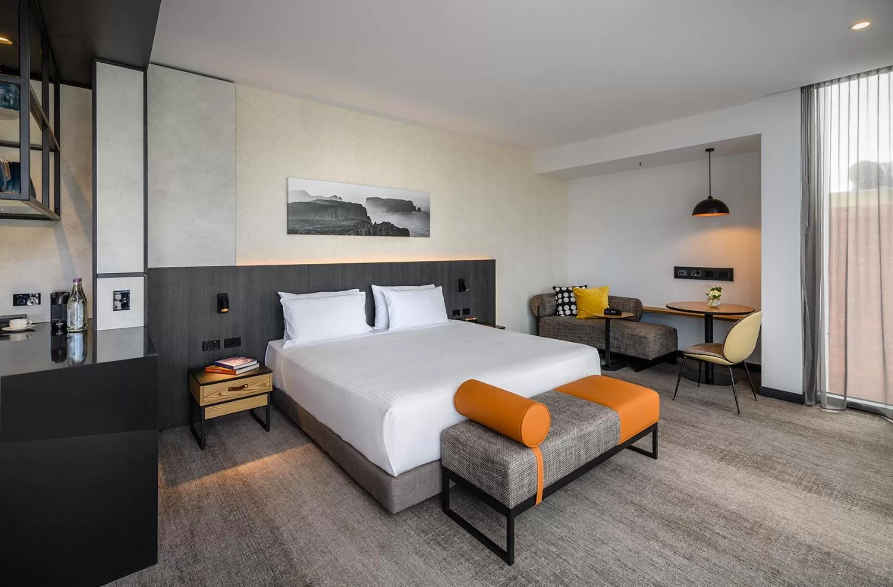 Seating area, Bed in Mövenpick Hotel Hobart