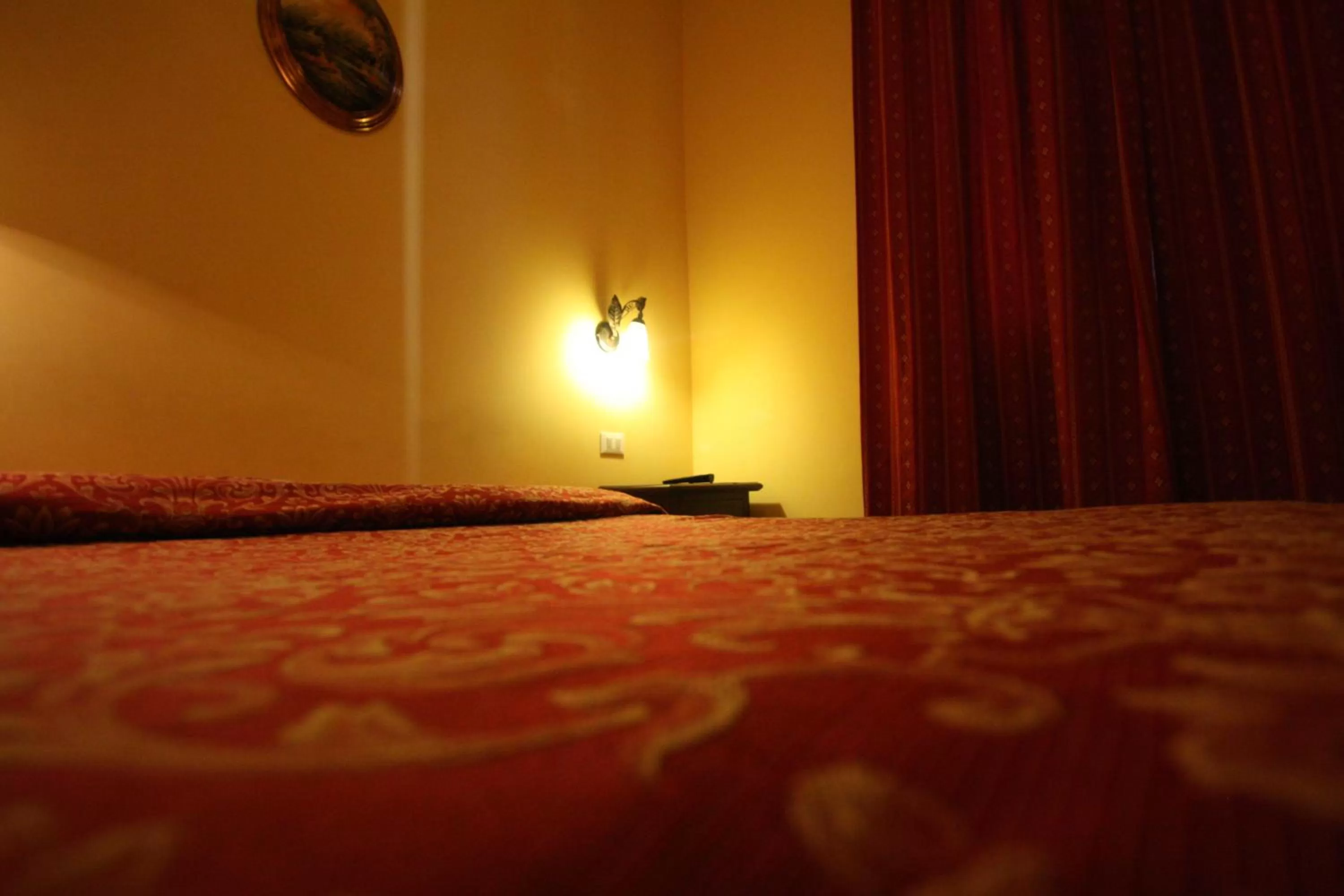 Bed in Hotel Cherubini