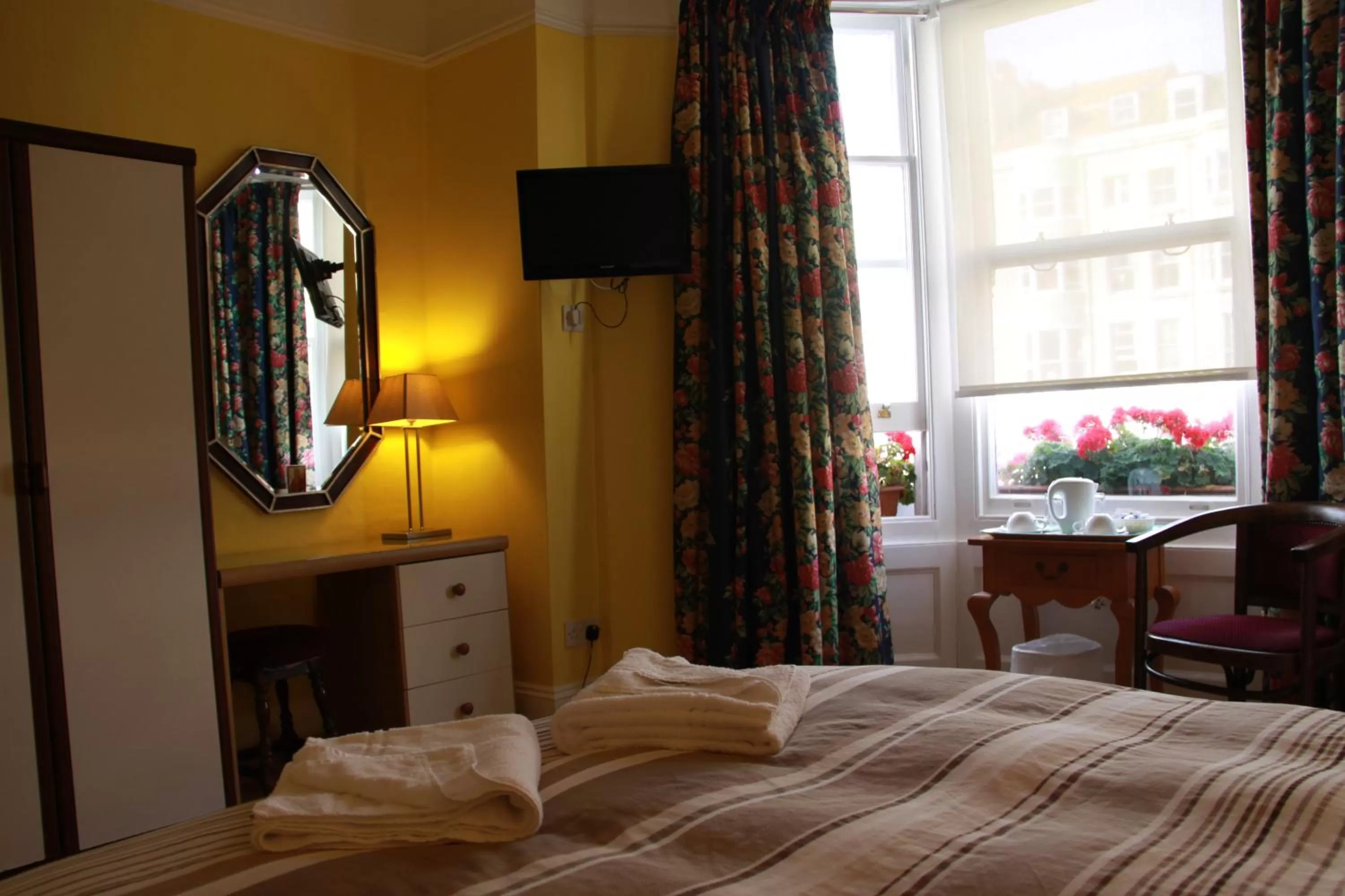 Bed in Ambassador Hotel