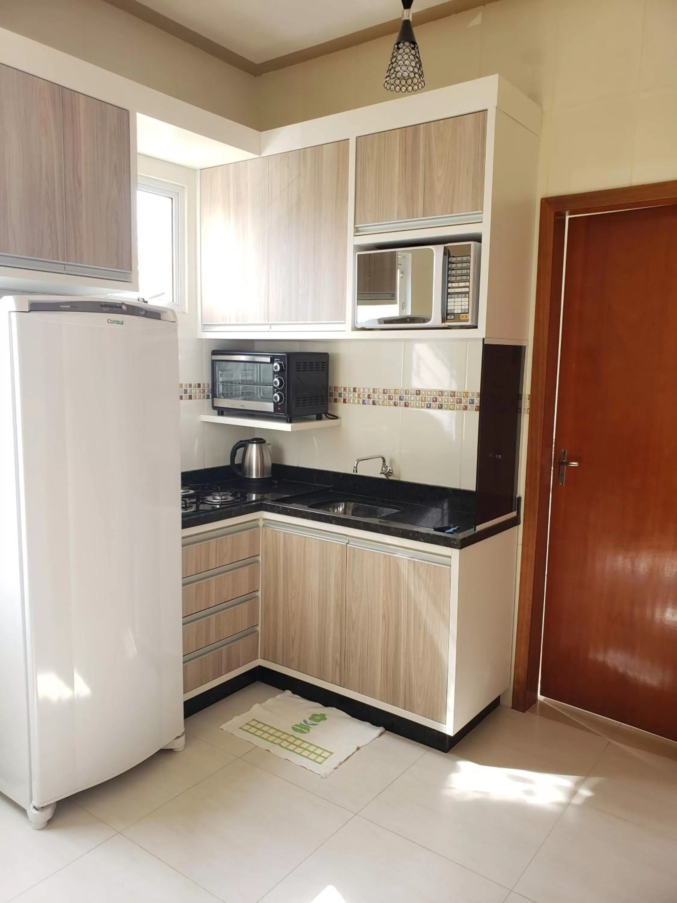 Kitchen or kitchenette in Felipe Family Houses - Casas de temporada