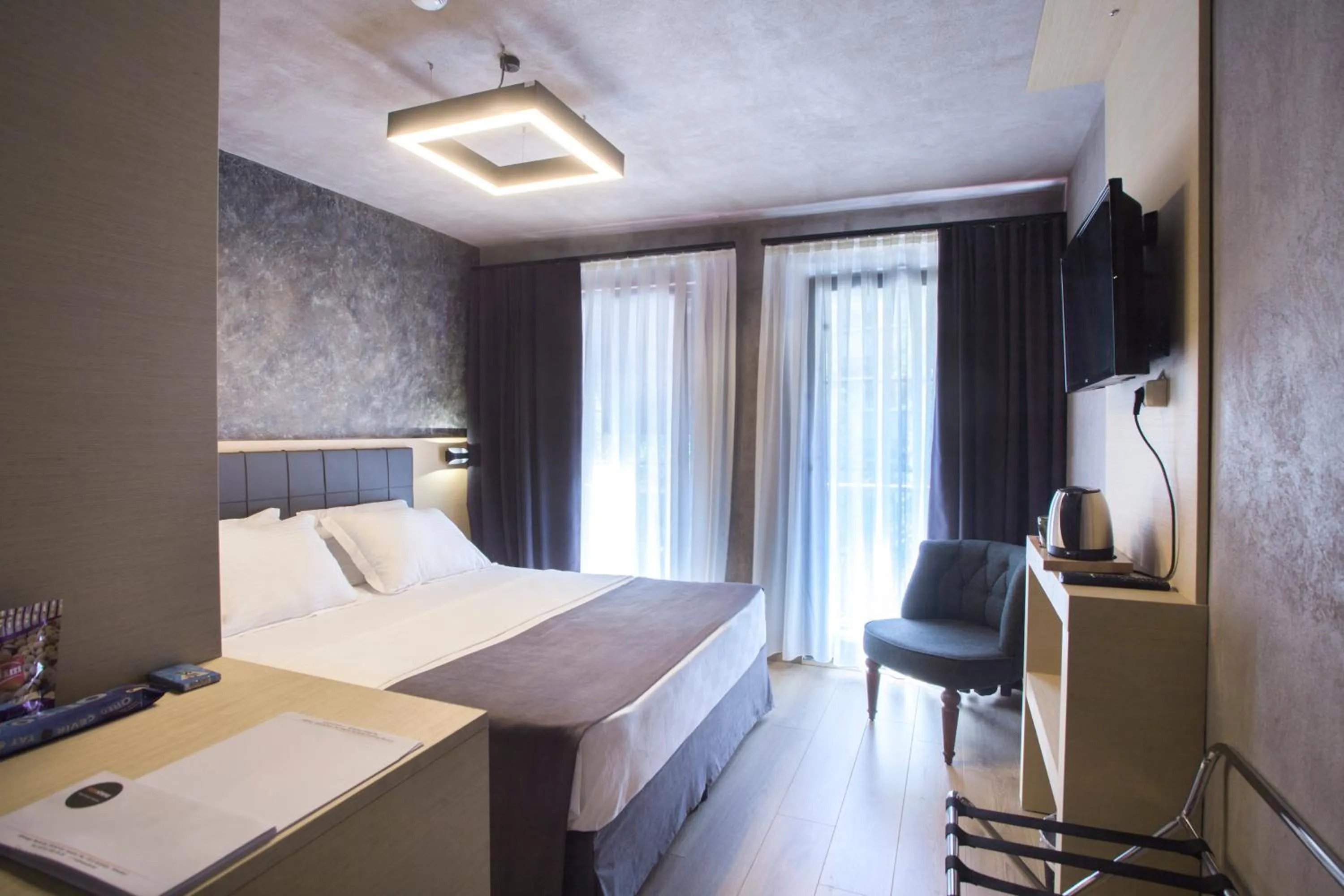 Bed in Red Stone Hotel