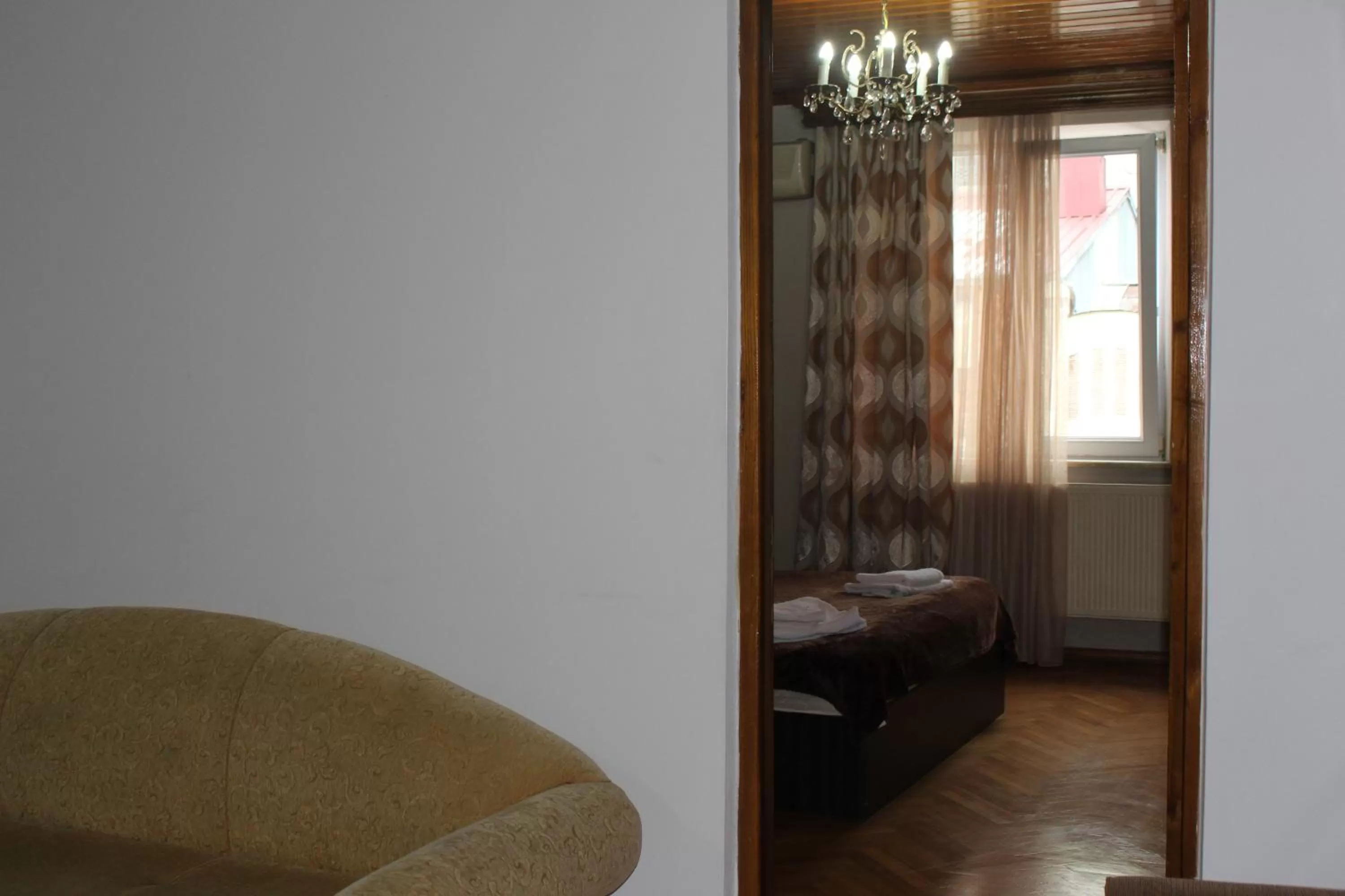 Bed, Seating Area in CATTALEYA