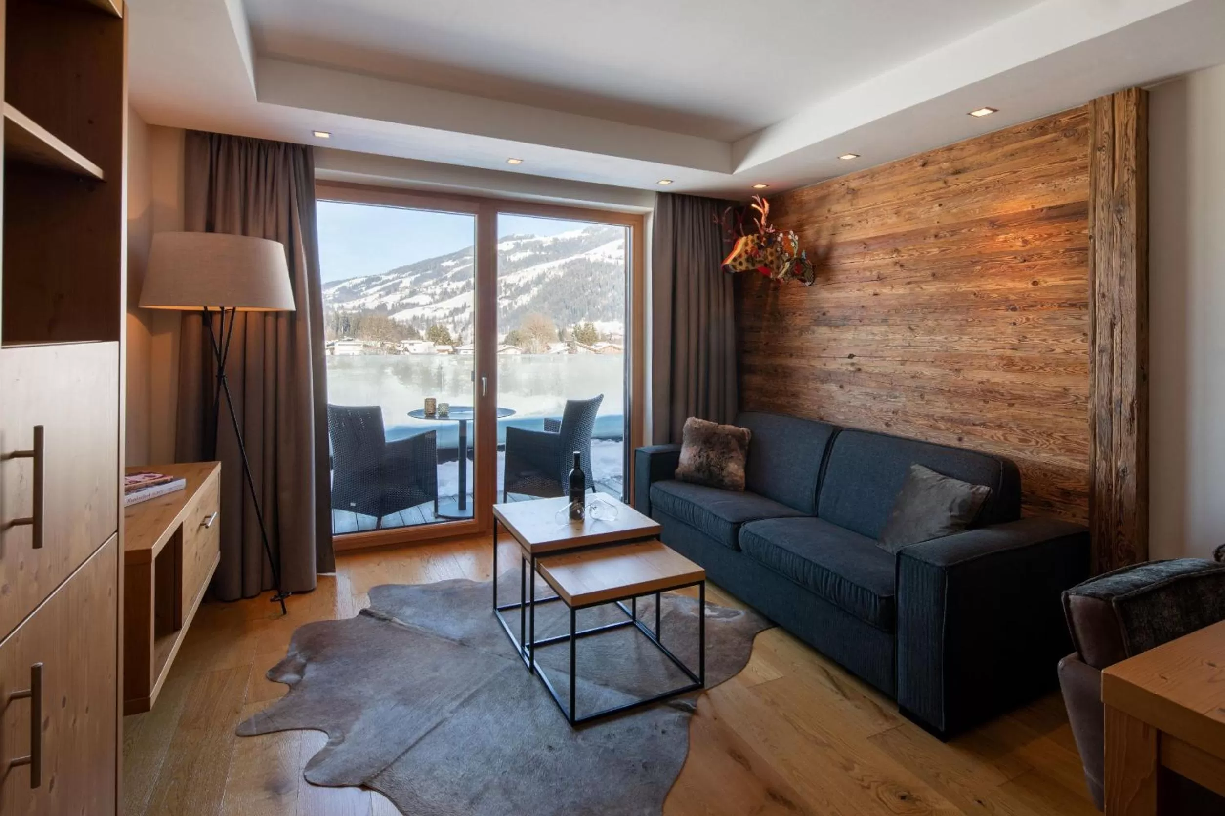 Living room in Berg & Golf Resort Westendorf by ALPS RESORTS