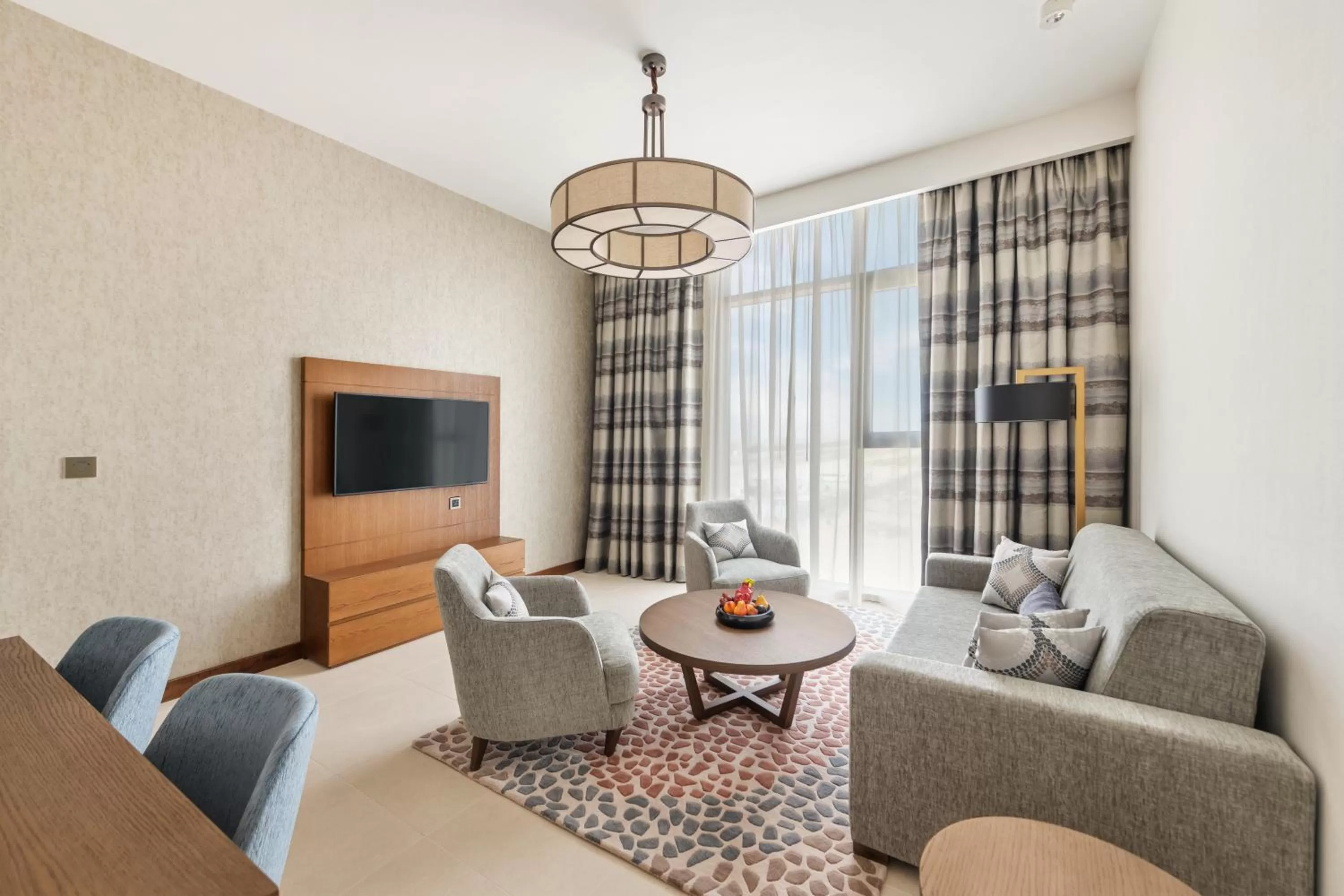 Living room in Staybridge Suites Dubai Al-Maktoum Airport by IHG