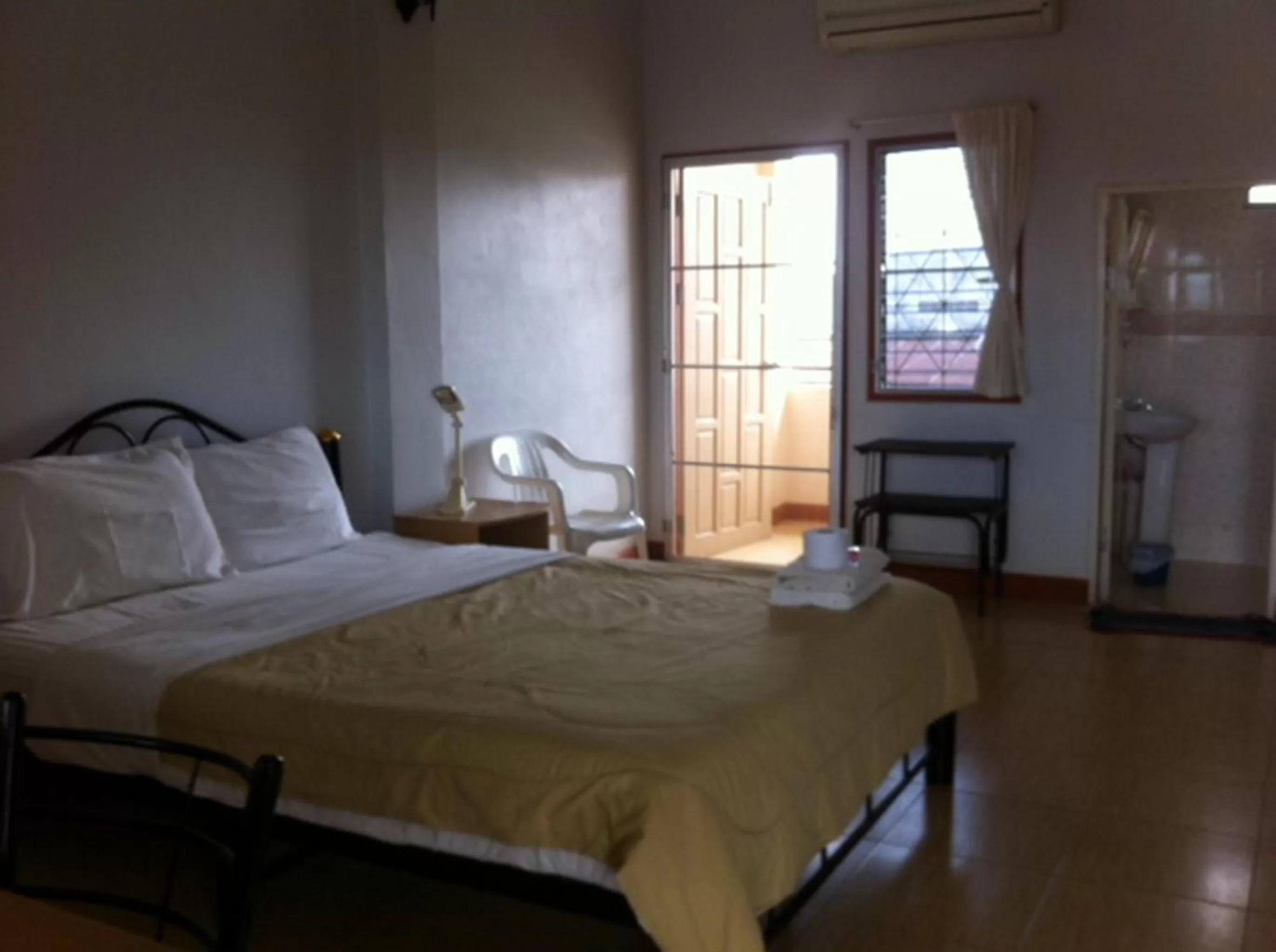 Bed in Pikul Apartment Hotel