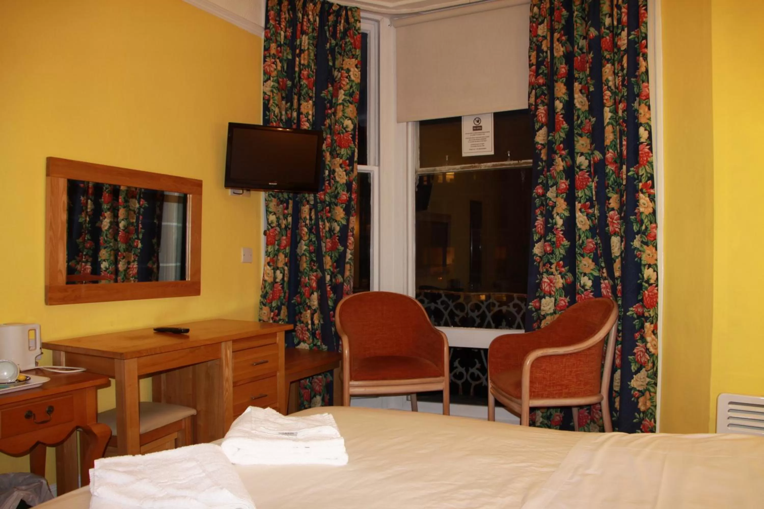 Bed in Ambassador Hotel