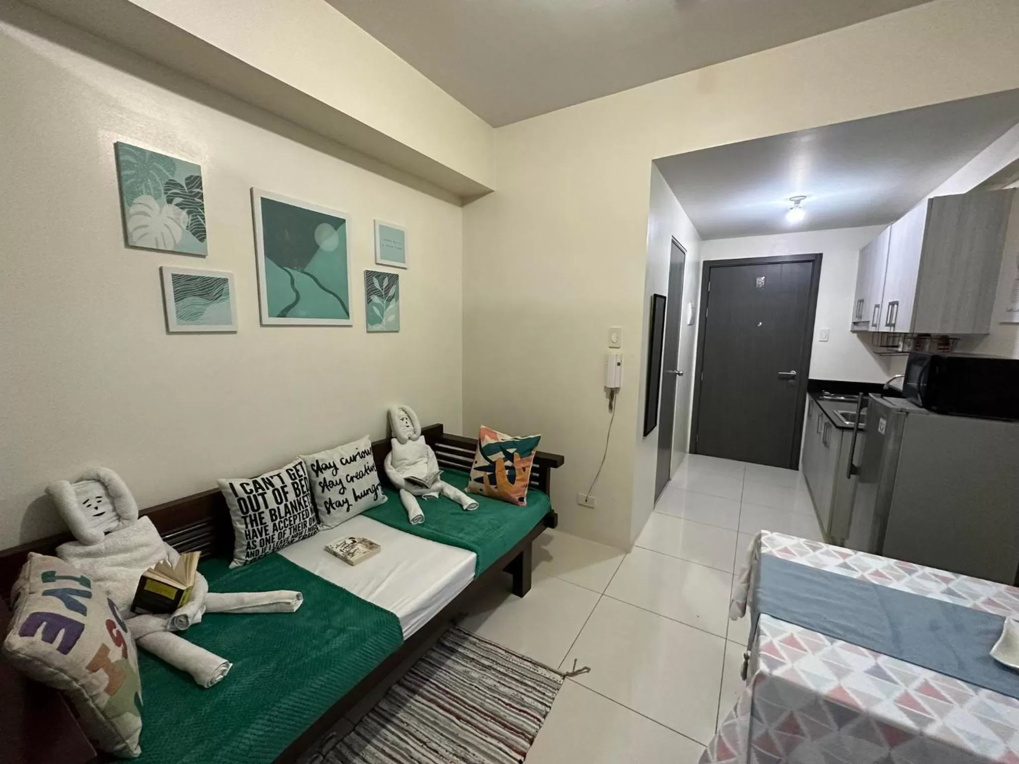 Bed in Green Residences Stays by PBYY