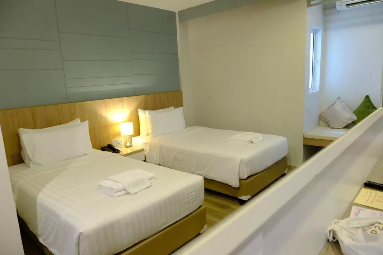 Bed in P21 Chiangmai Hotel