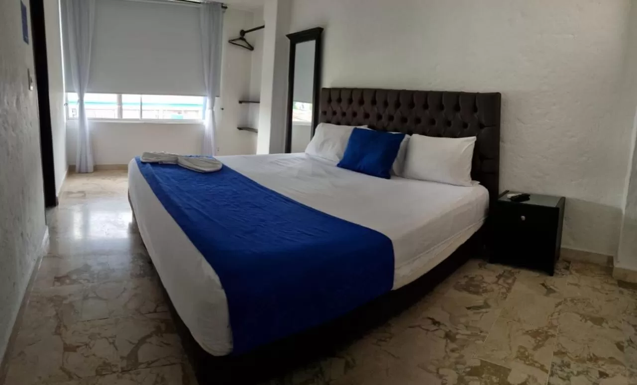 Bed in Blue Star Hotel