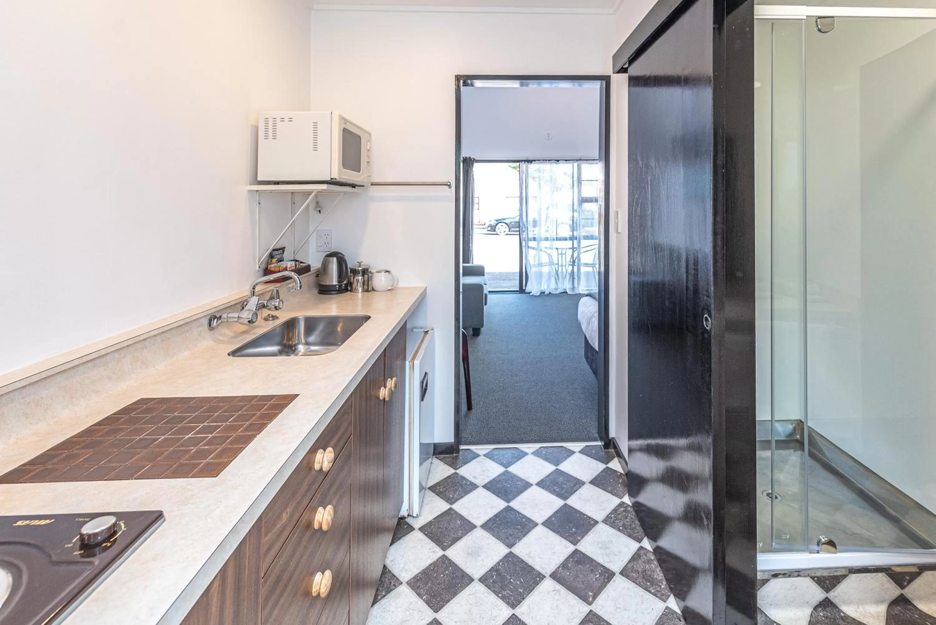 Kitchen or kitchenette in Burwood Motel