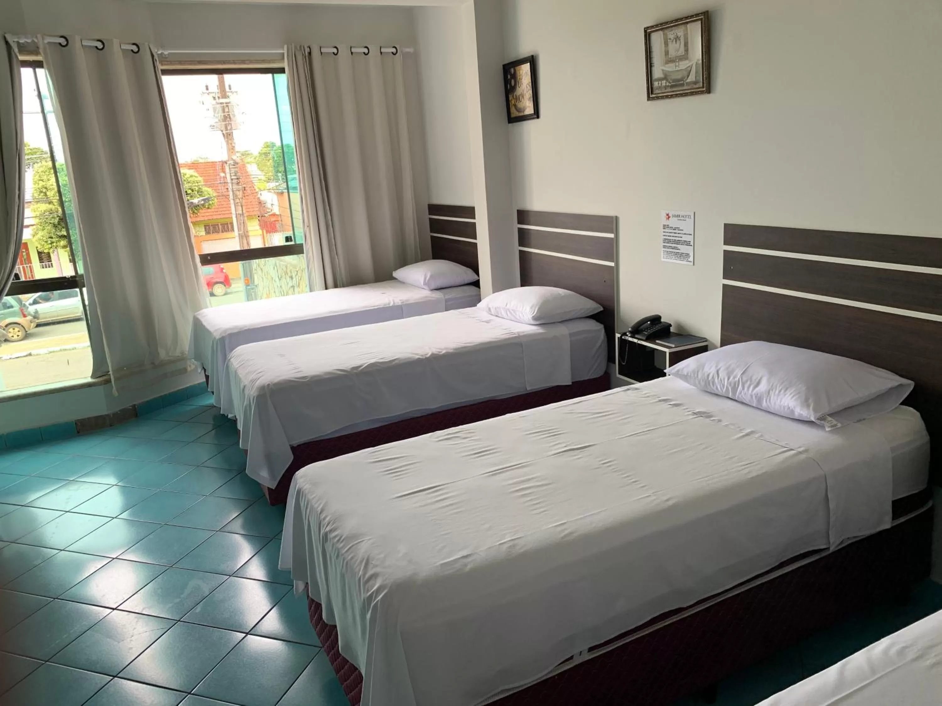 Bed in SAMIR HOTEL COMFORT