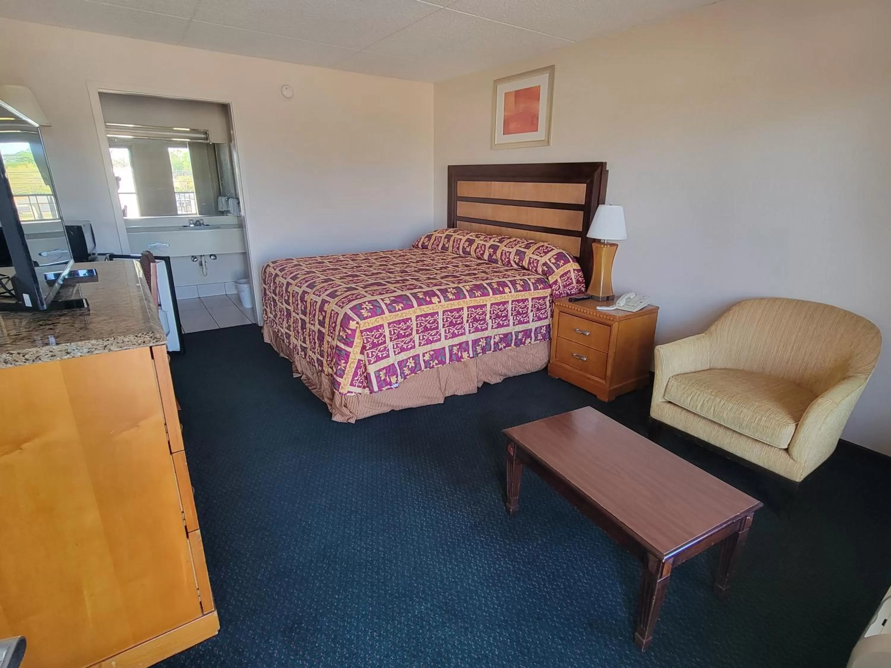 Bed in Studio 9 Inn & Suites