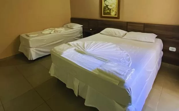 Bed in Pousada Jovimar