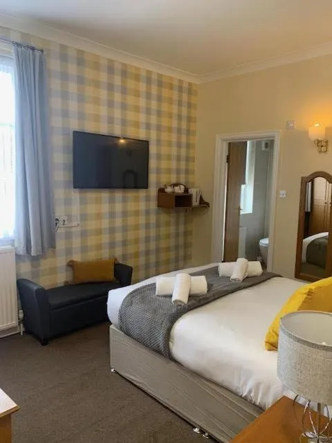 Bed in The Dickens Bar & Inn