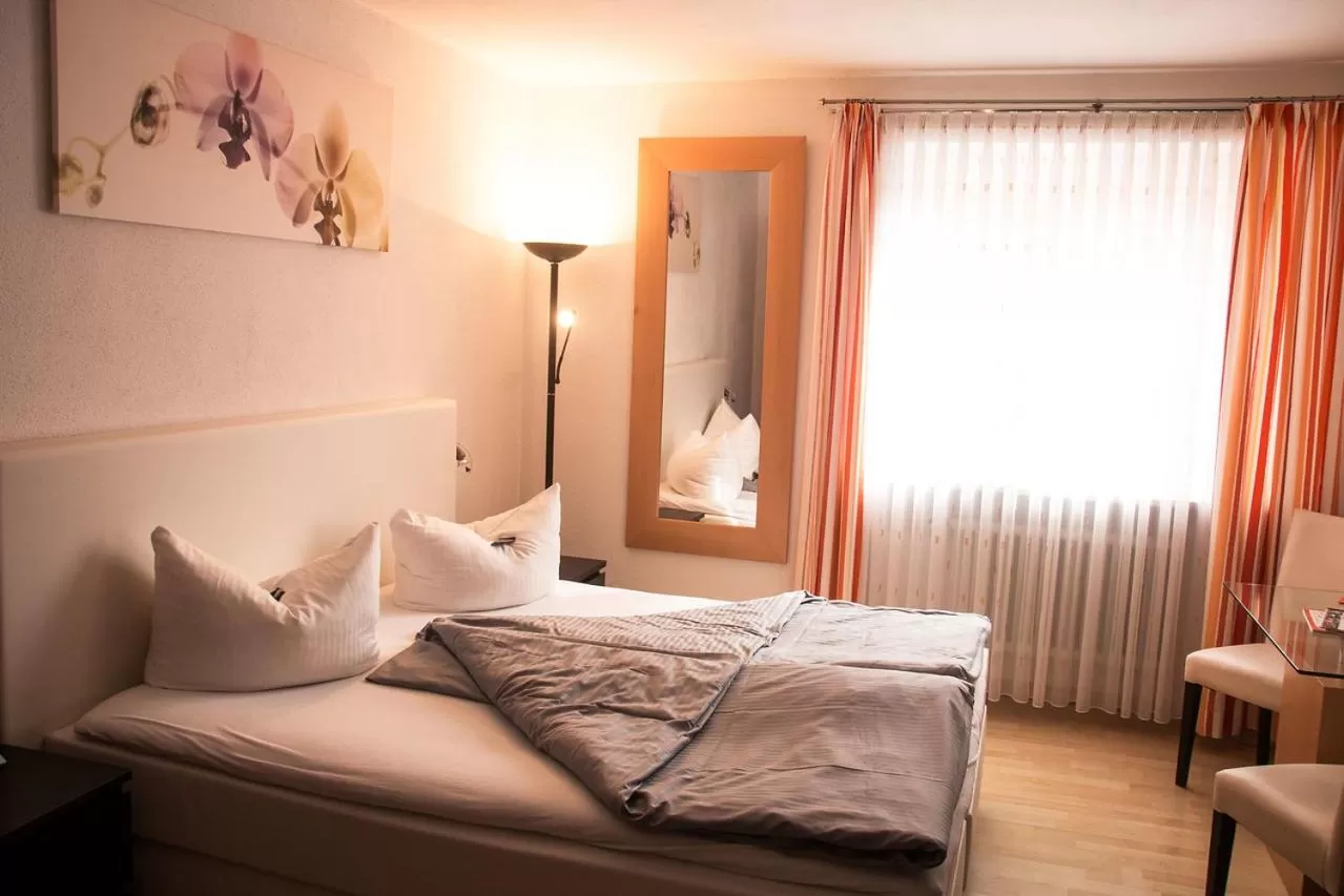 Photo of the whole room, Bed in Landhotel Weißer Hahn