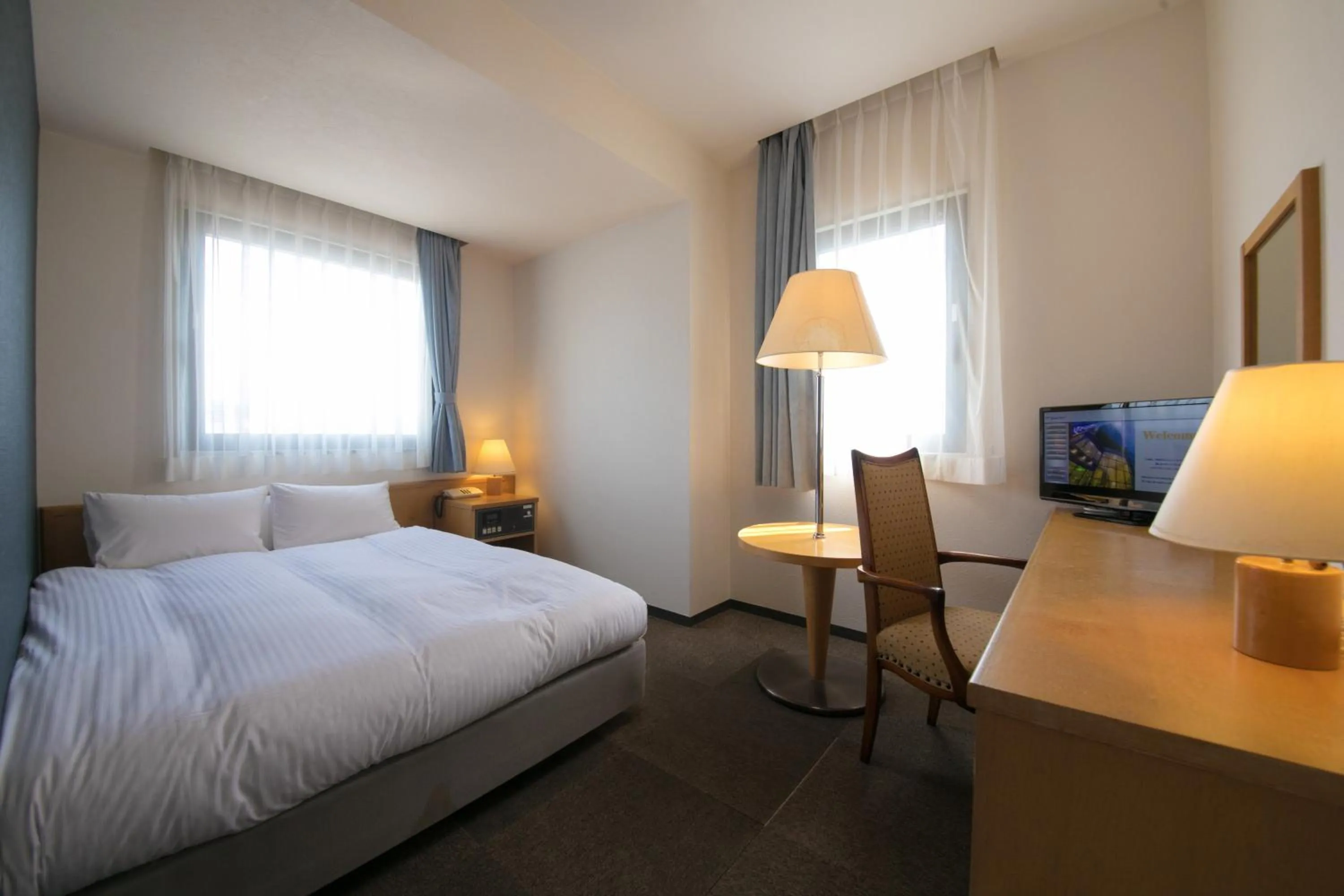 Bed in Heiwadai Hotel 5