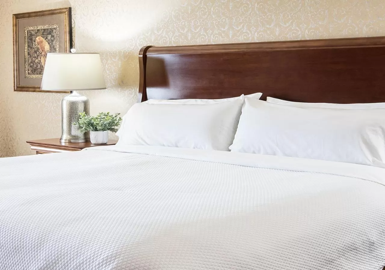 Bed in Grand Gateway Hotel