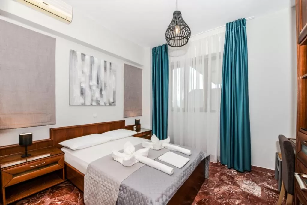 Bedroom in V & G Cozy Apartments