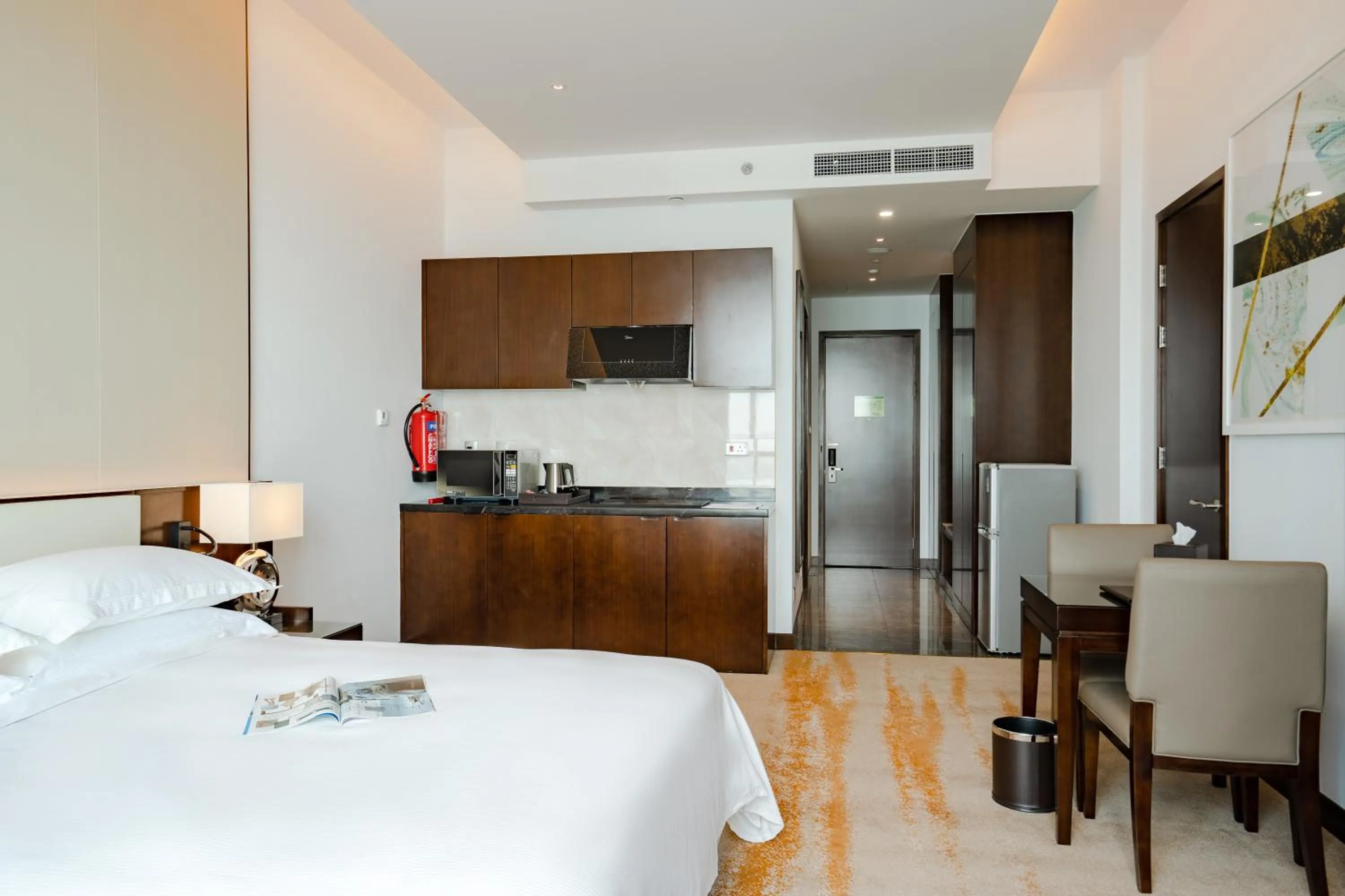 Kitchen or kitchenette, Bed in Johari Rotana