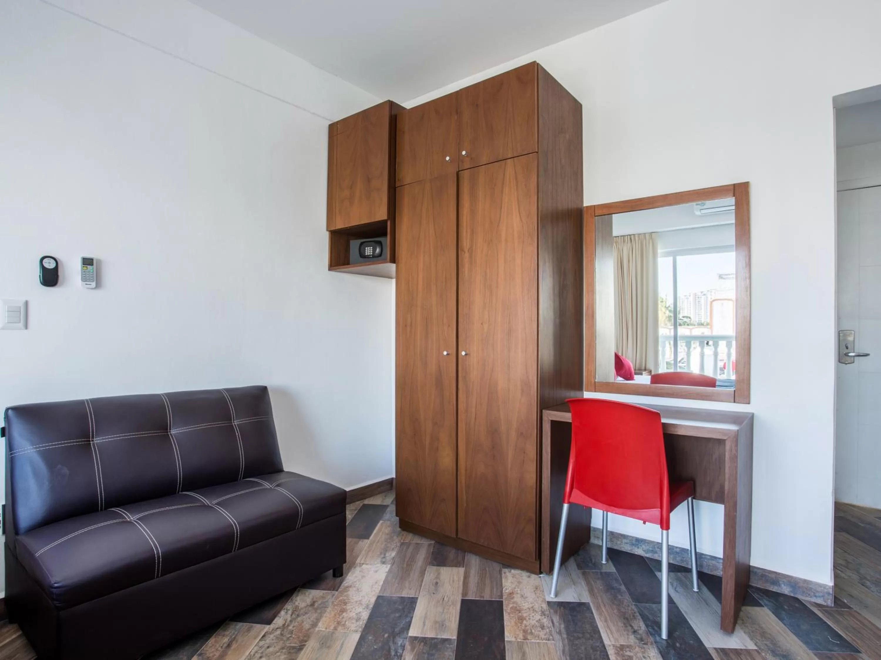 Bedroom, Seating Area in Capital O Cancun Ocean View, Cancún