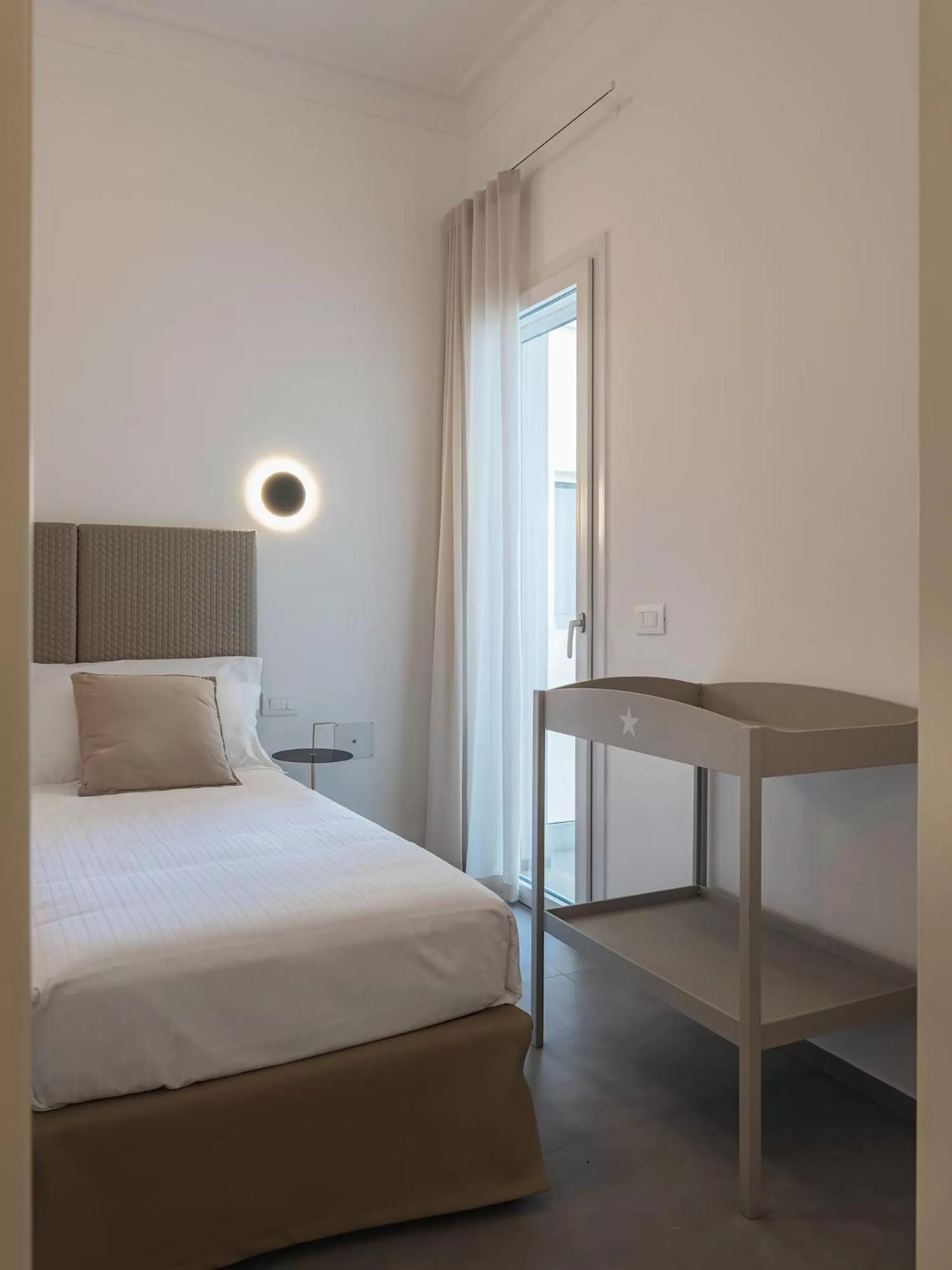 Photo of the whole room, Bed in Living u HomeSuites