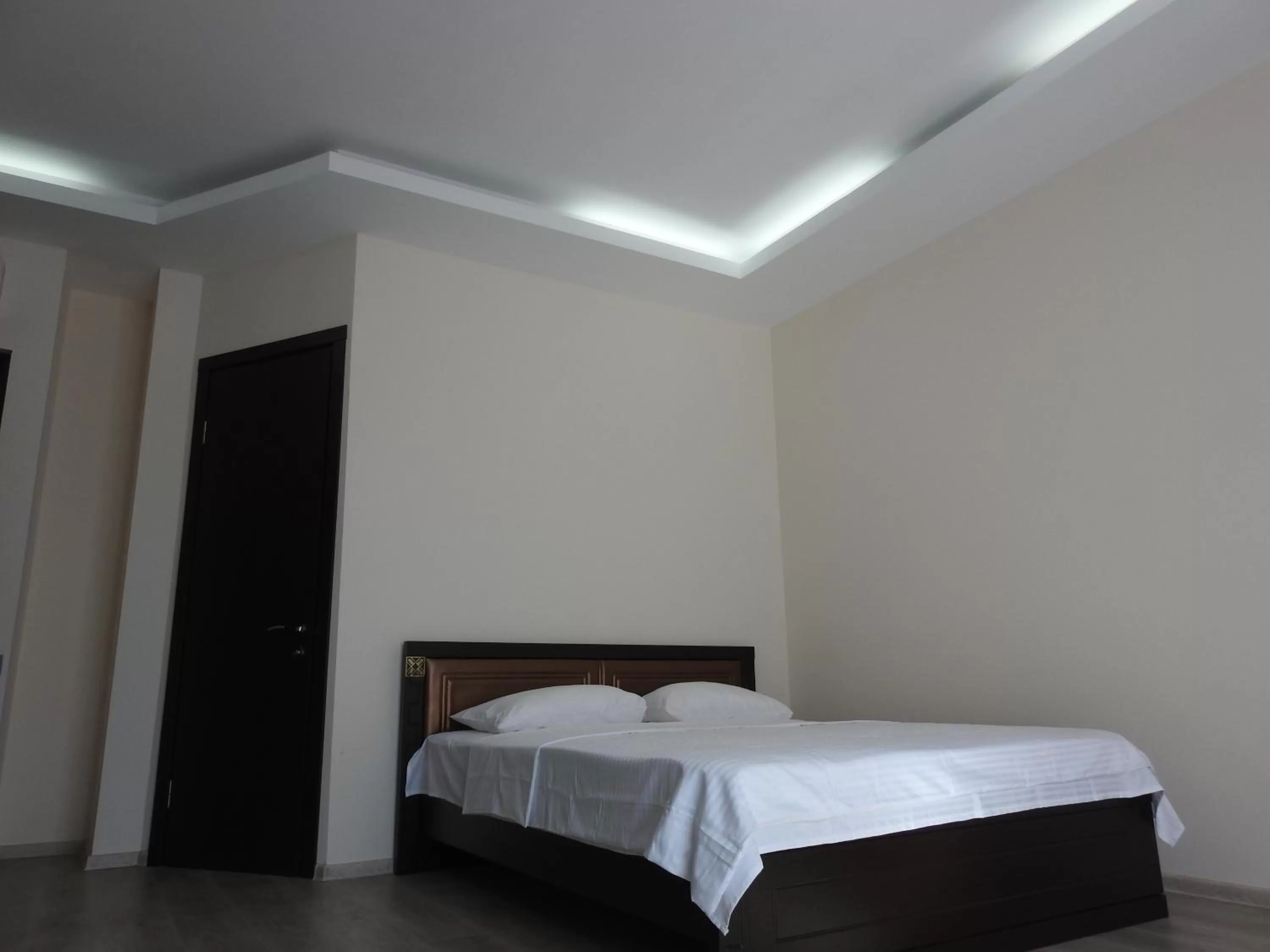 Bed in Iko's Family Apartments