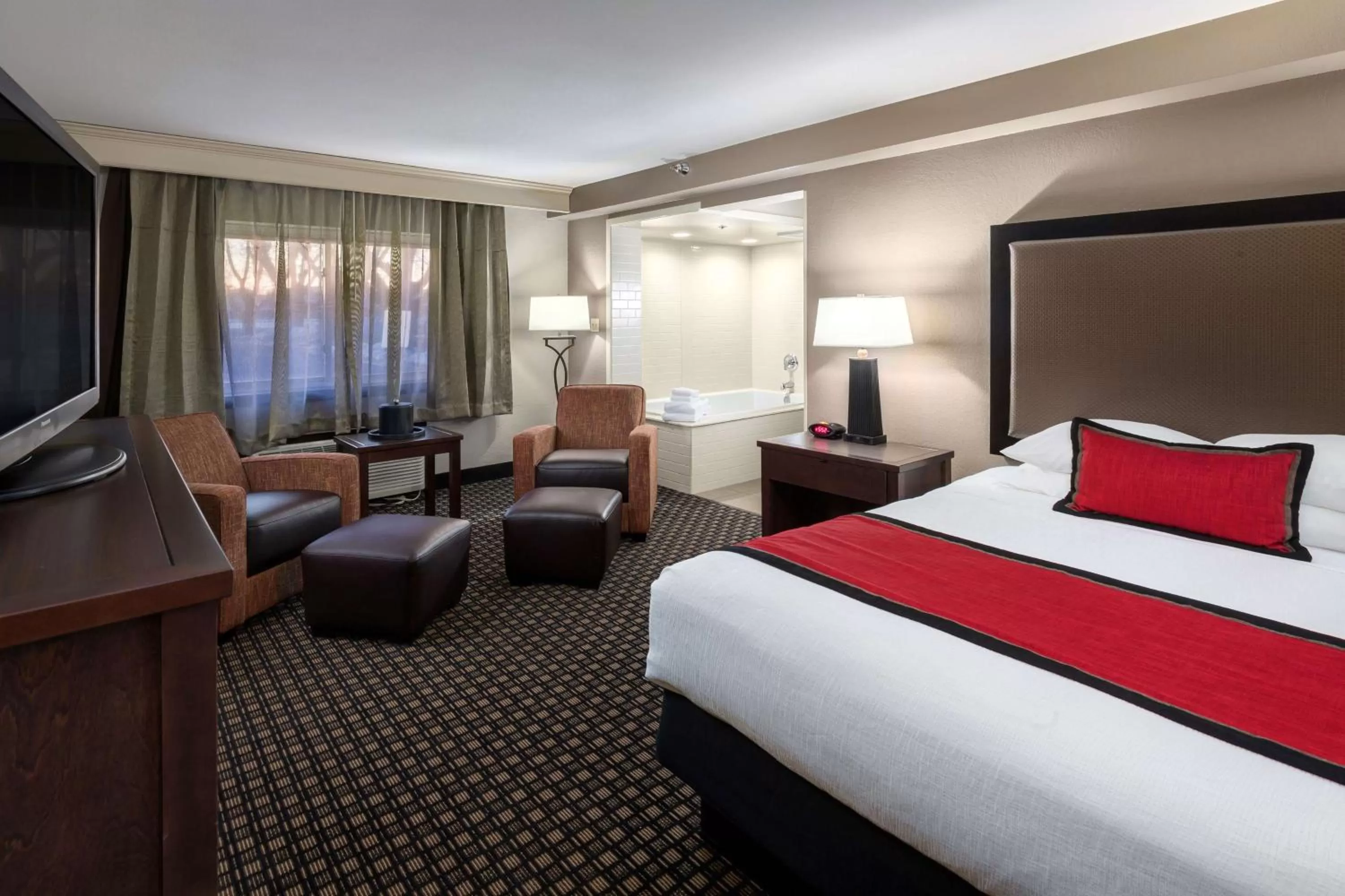 Two-Room King Suite with Sofa Bed and Soaker Tub in Best Western Plus Ramkota Hotel