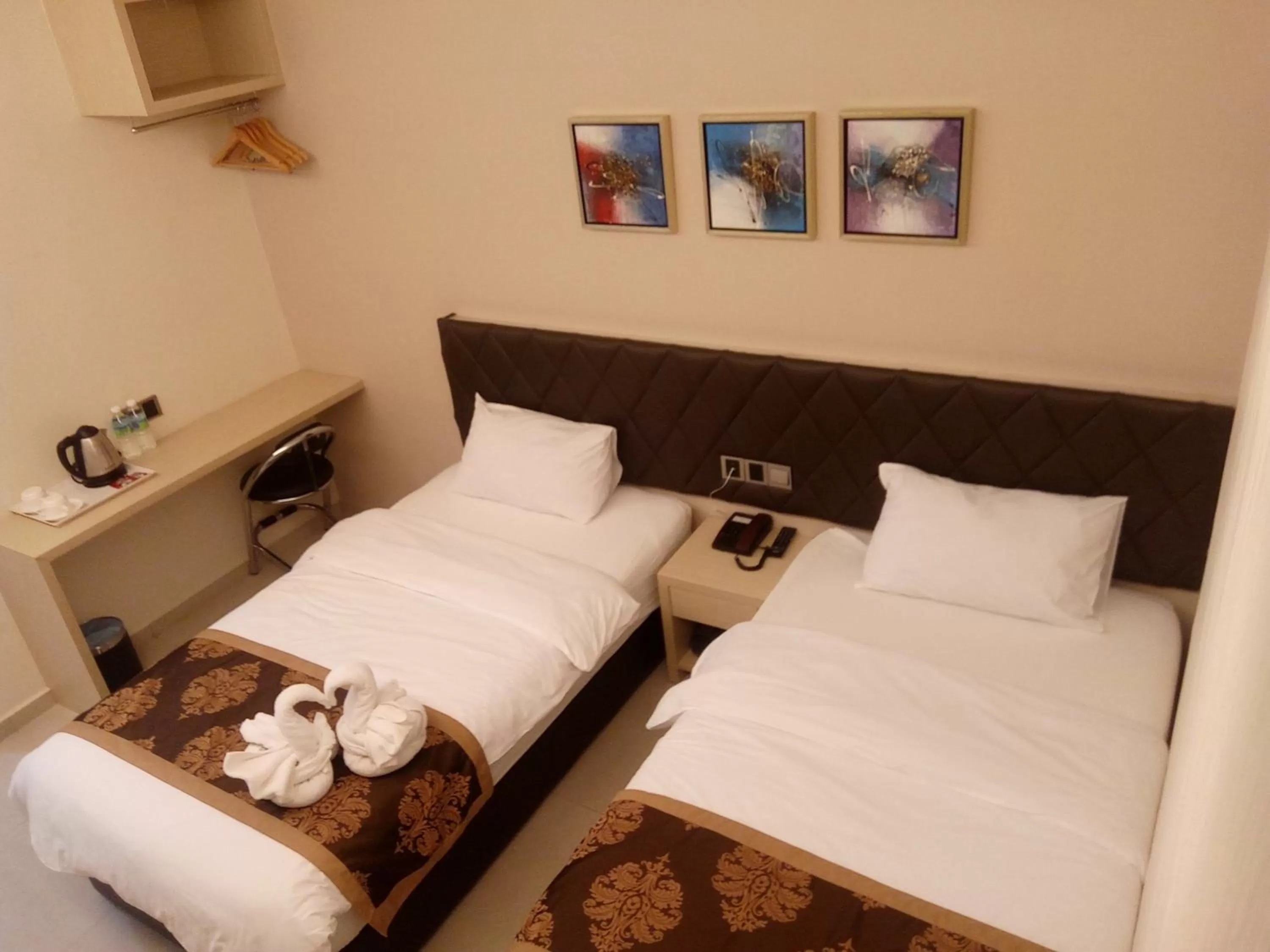 Bed in Golden Leaves Hotel