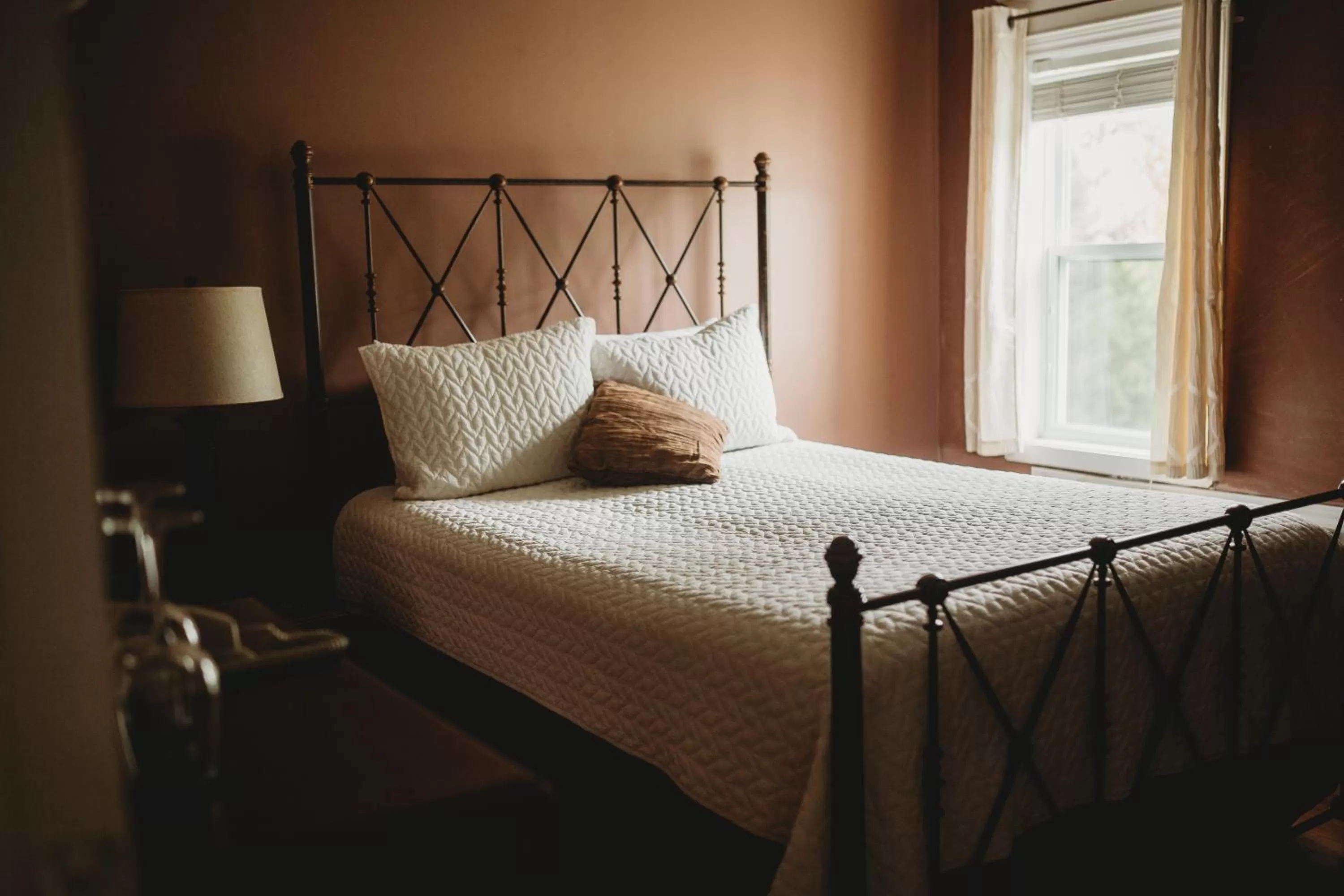 Bedroom, Bed in Carriage House Inn Four and a Half Stars