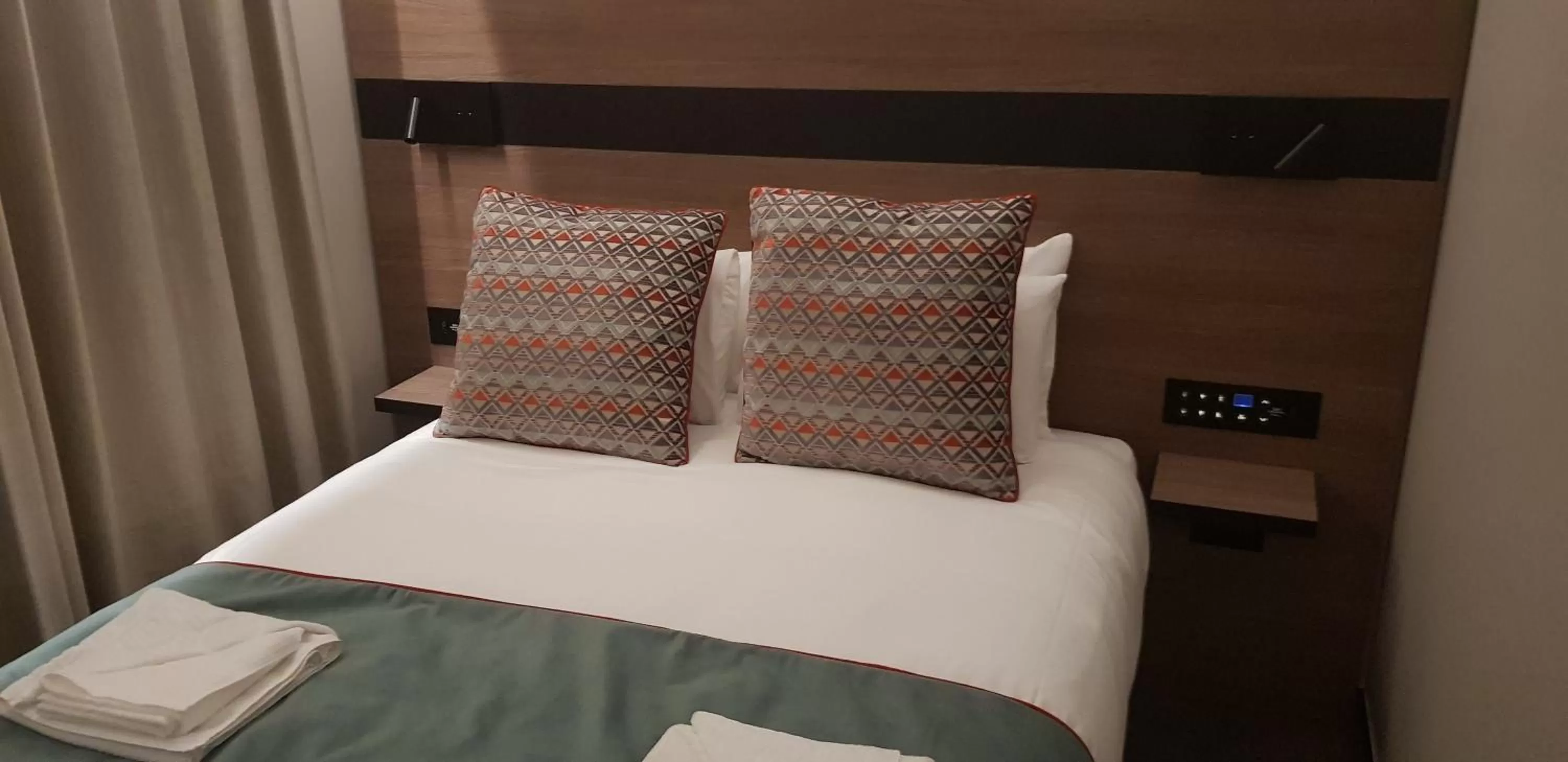 Bed in Merit Kensington Hotel