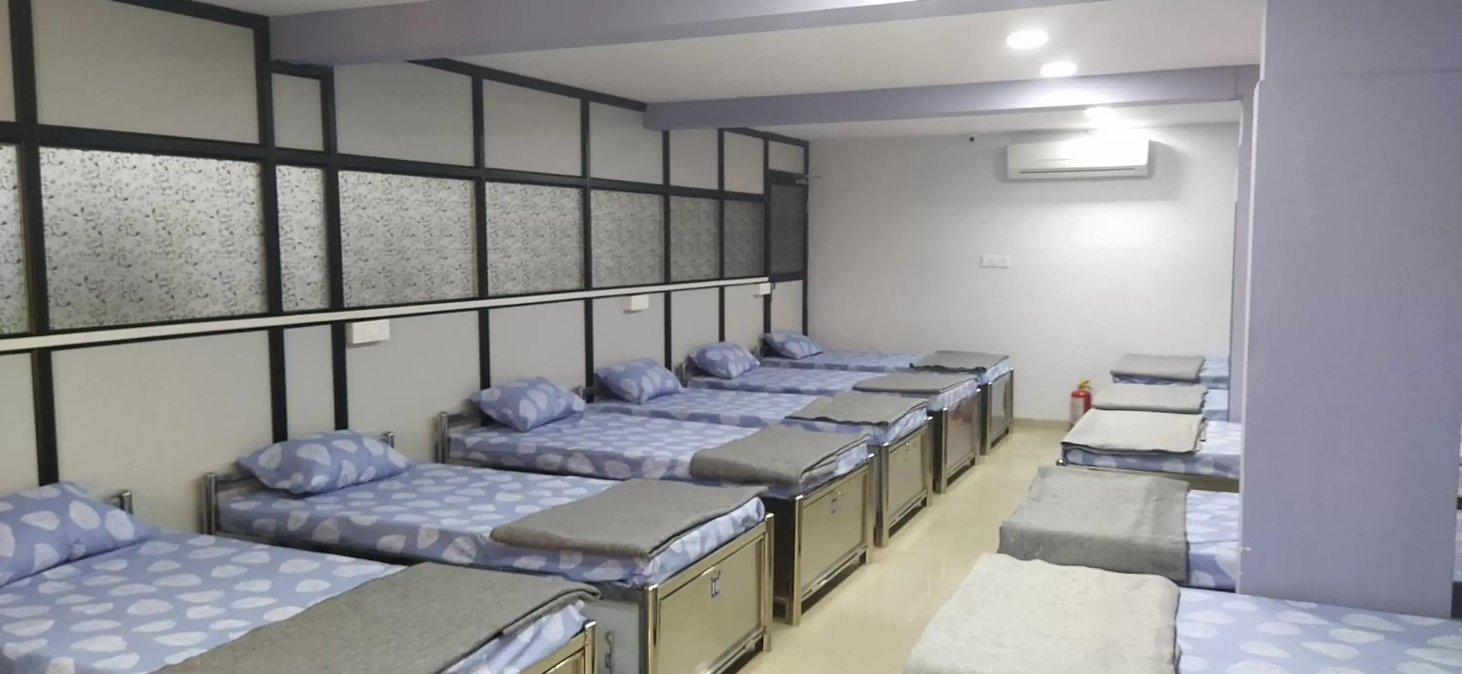 Bed in Male Dormitory Room in Shiv Sai Dormitory Bed in Male Dormitory Room in Shiv Sai Dormitory