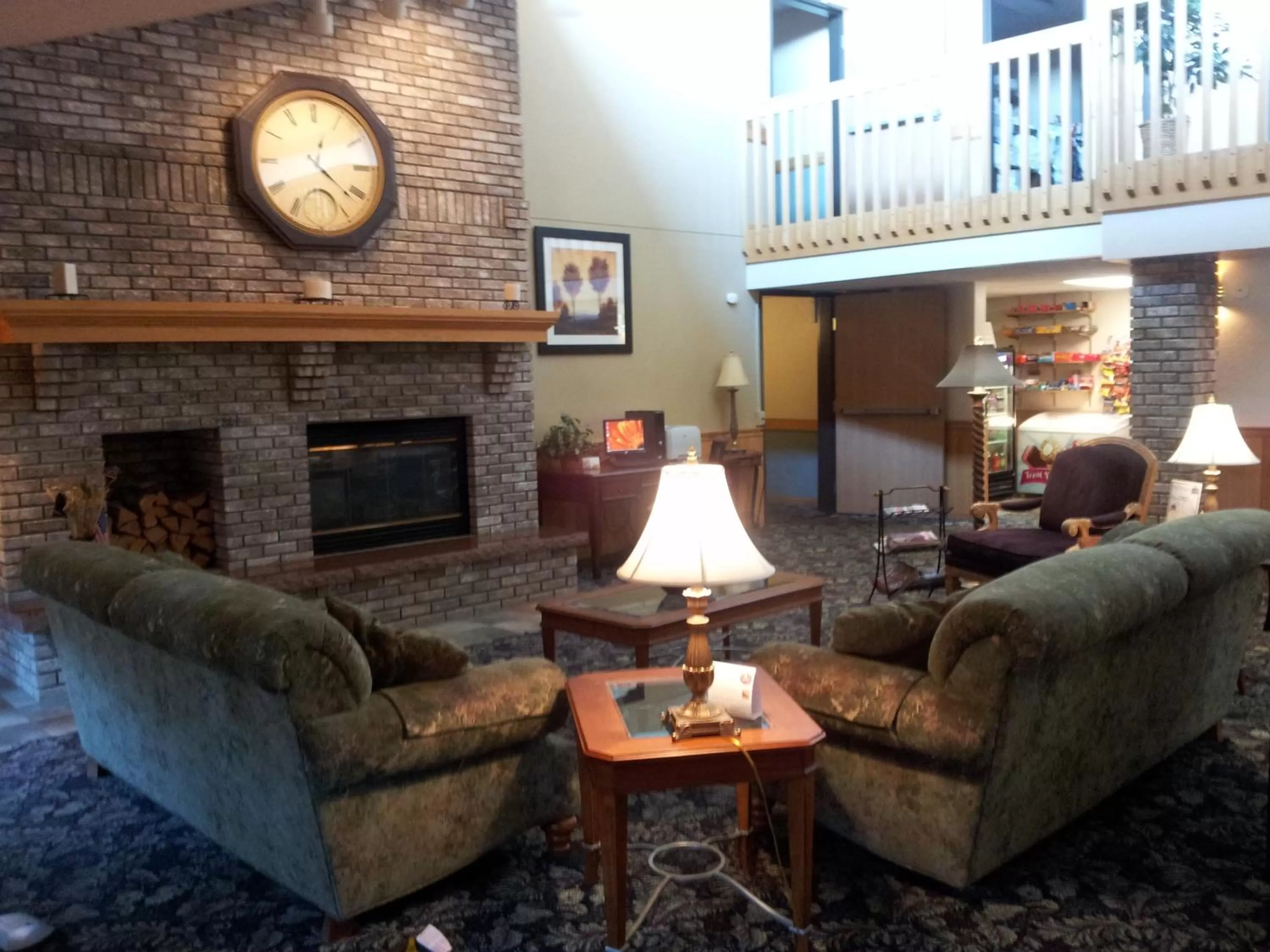 Communal lounge/ TV room in Cobblestone Hotel & Suites - Wisconsin Rapids