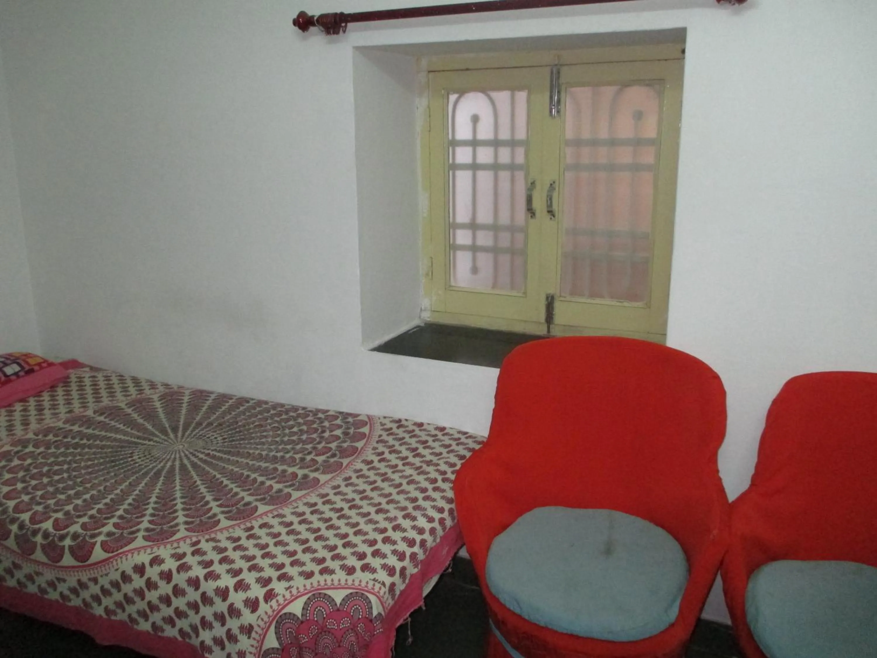 Bed in Udai Haveli Guest House