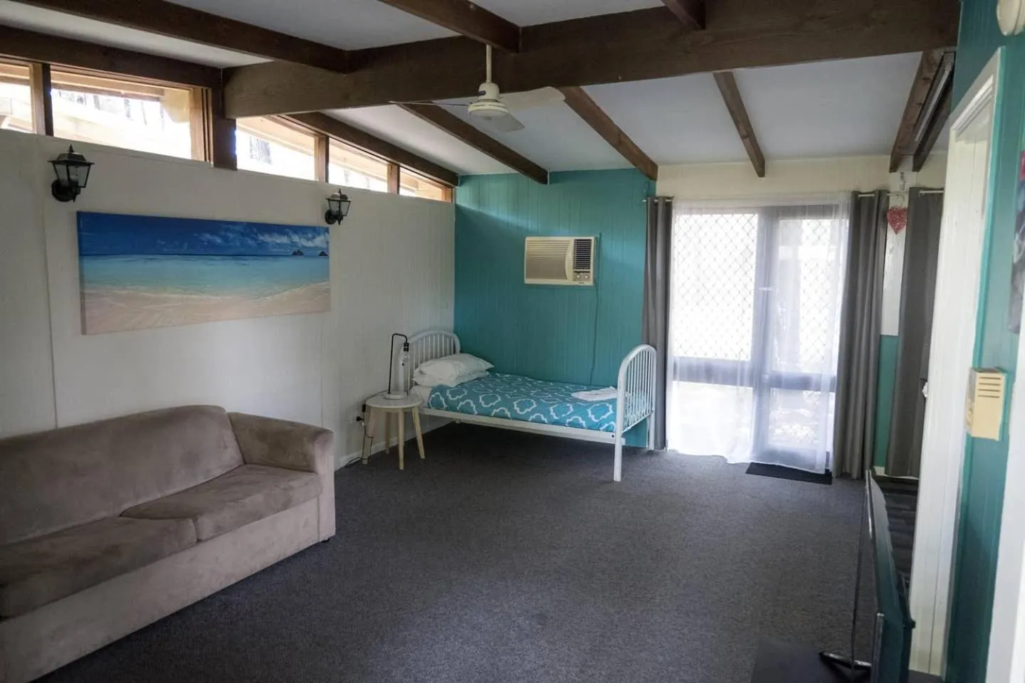 Bed in Colonial Village Resort