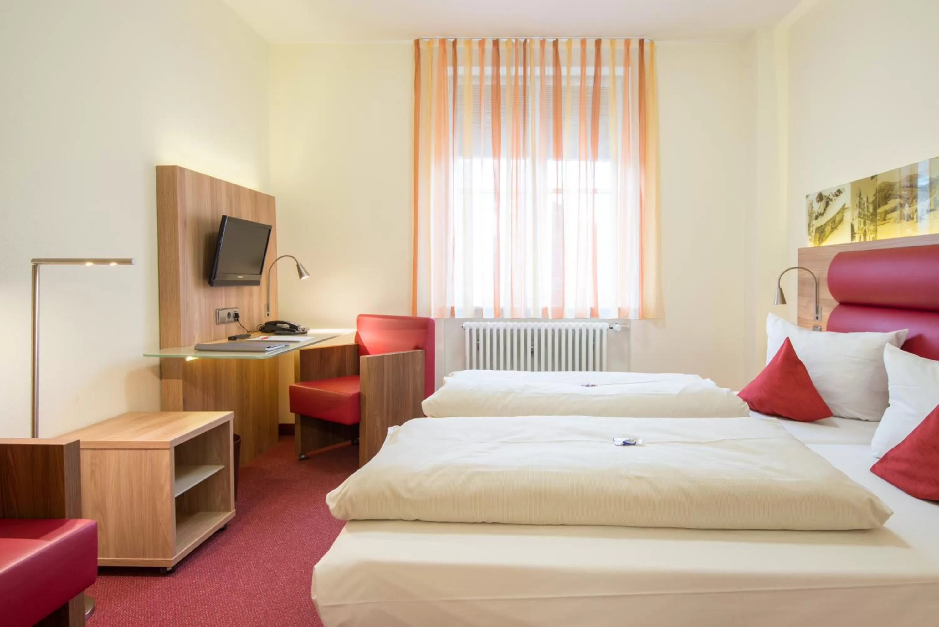 Photo of the whole room, Bed in Stadthotel Freiburg Kolping Hotels & Resorts