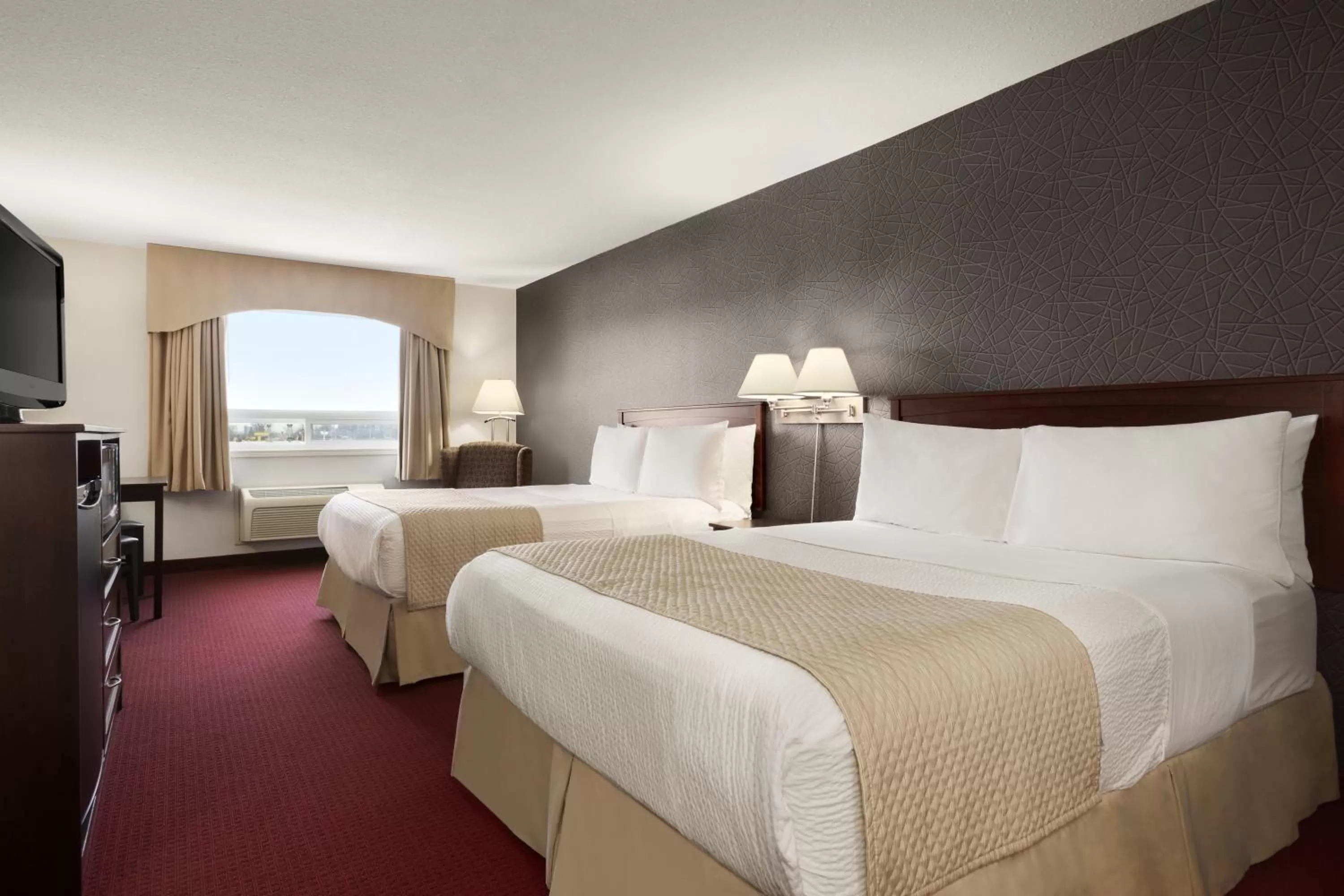 Photo of the whole room, Bed in Days Inn & Suites by Wyndham Brandon