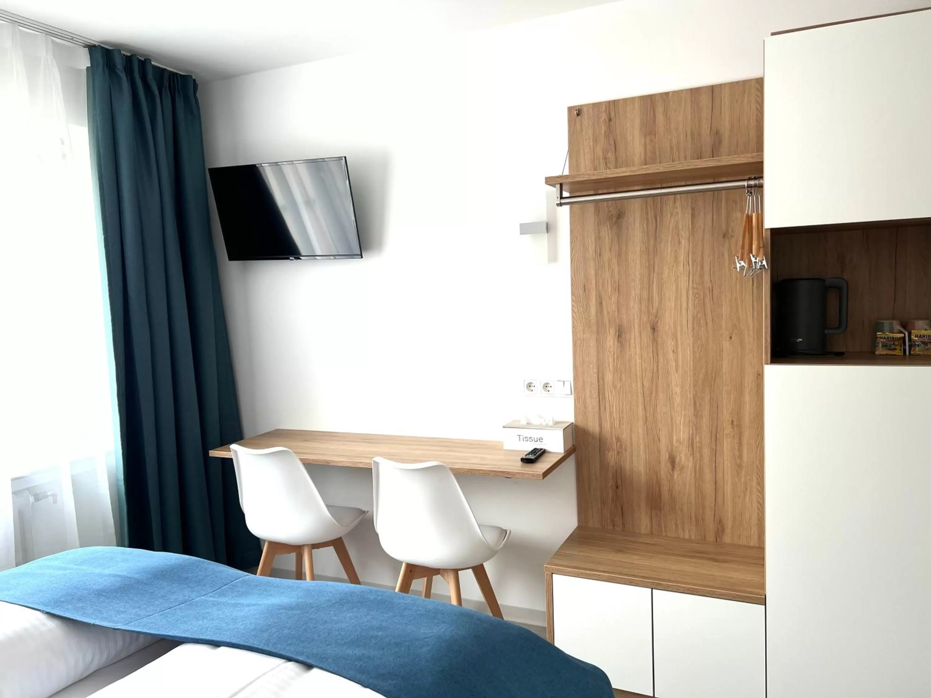 TV and multimedia, TV/Entertainment Center in Hotel 83