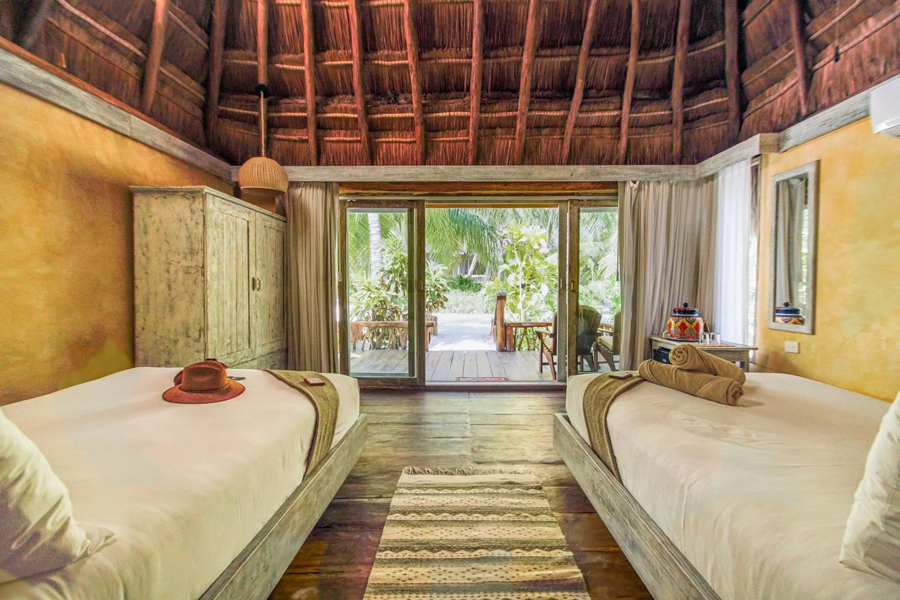 Bedroom, Bed in Villa Pescadores Tulum-Beachfront hotel by Ahau Collection