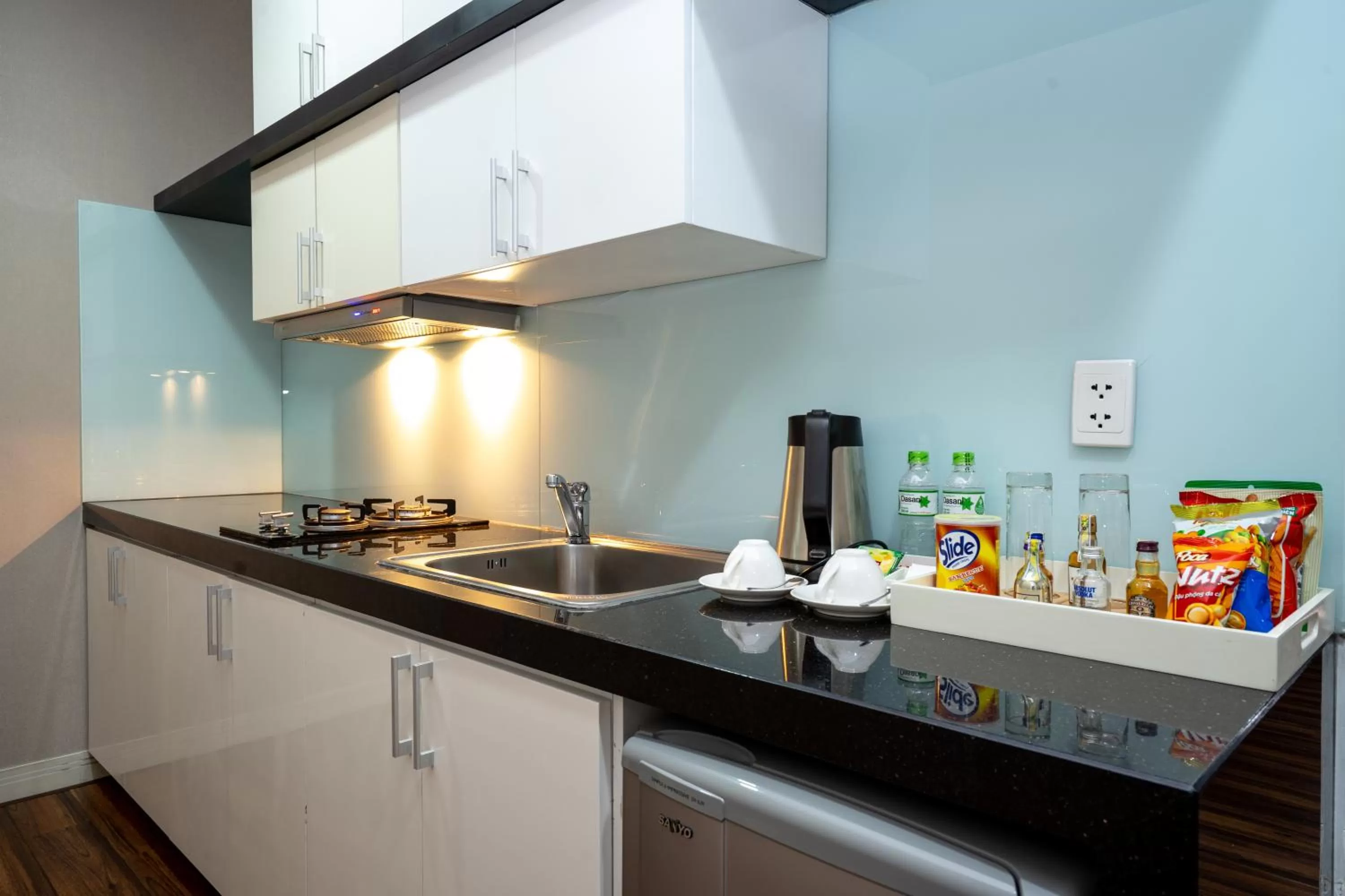 Kitchen or kitchenette in Becamex Hotel Thu Dau Mot