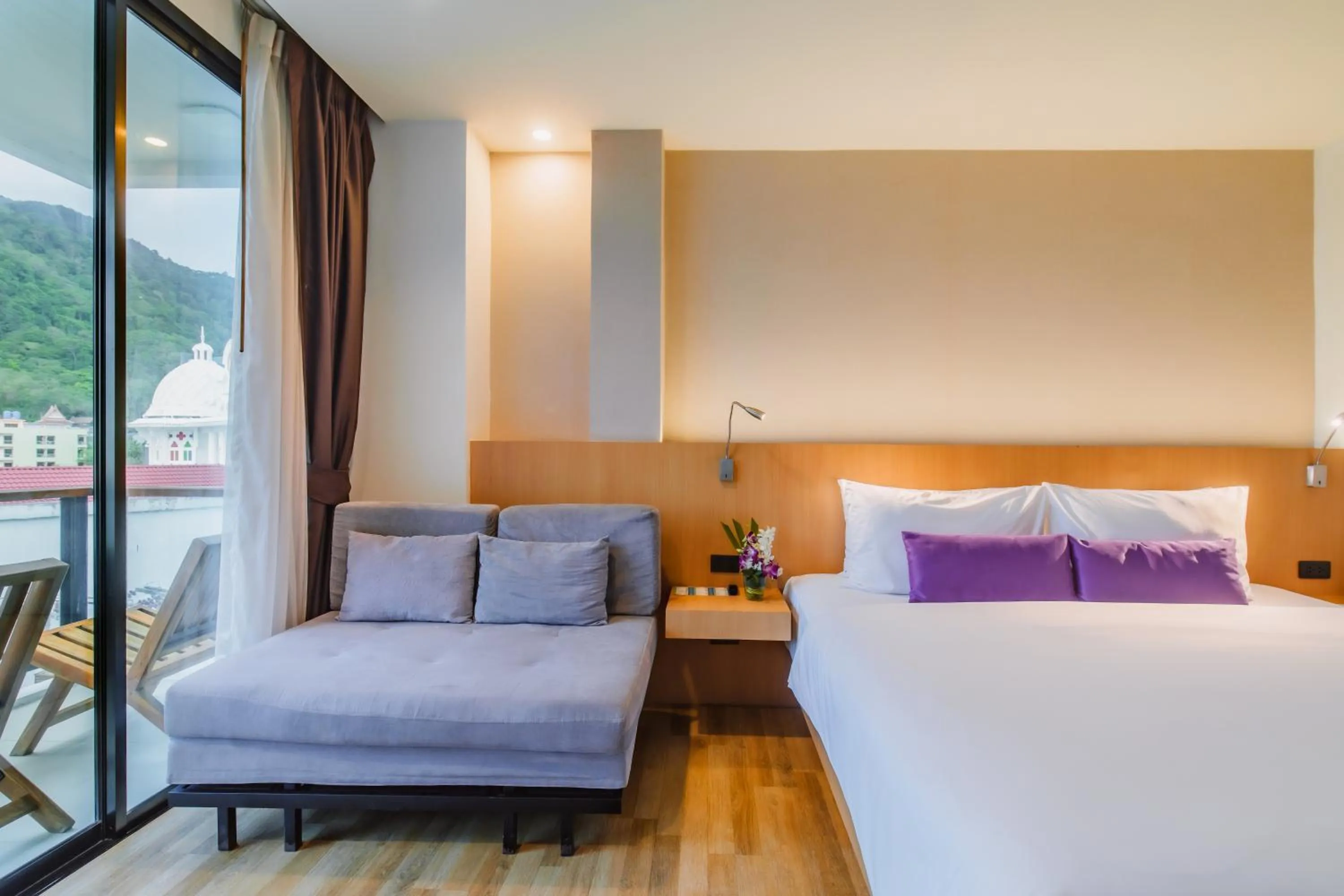 Seating area, Bed in The Lunar Patong