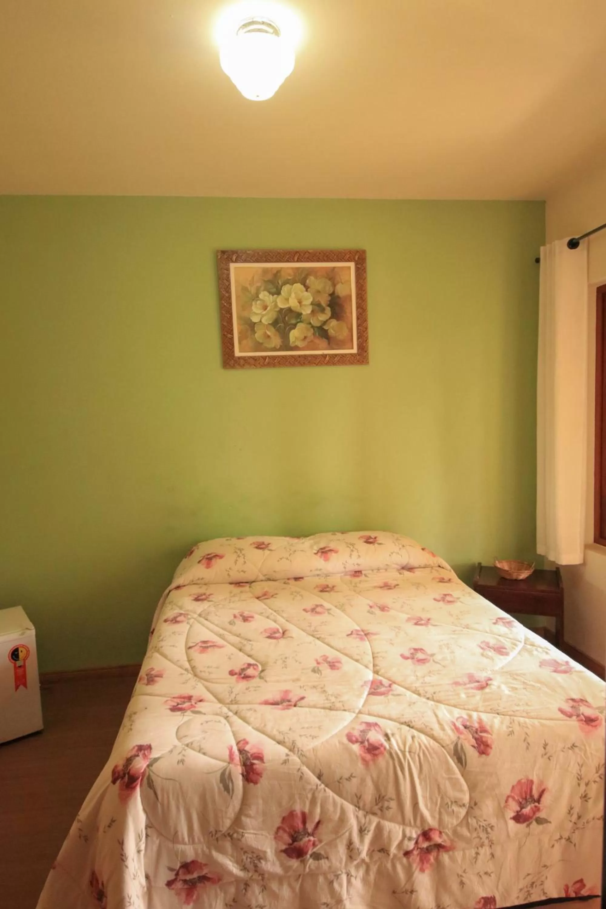 Bed in Pousada Curumi