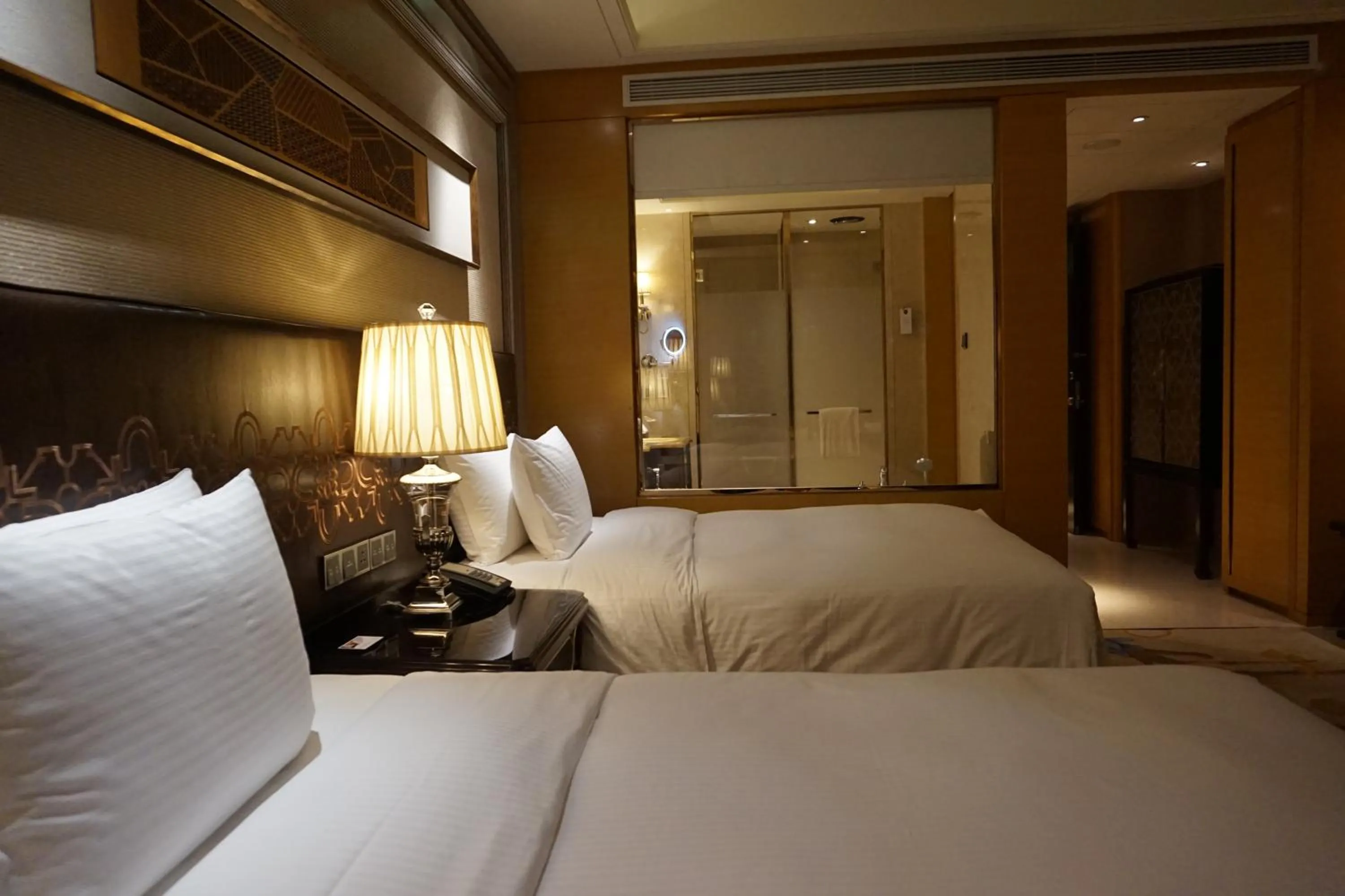 Bed in Wanda Realm Harbin Hotel