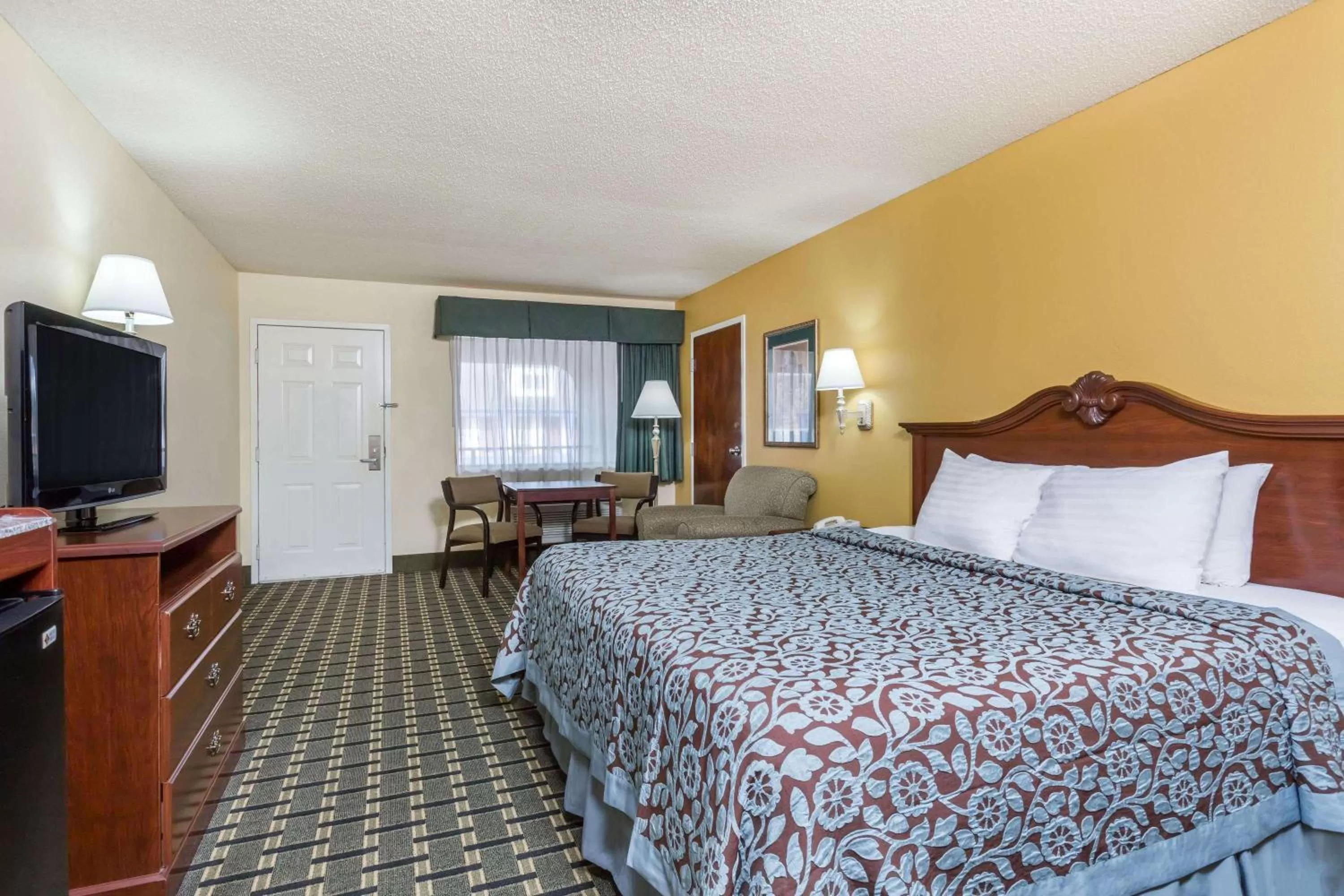 Photo of the whole room, Bed in Days Inn & Suites by Wyndham Warner Robins Near Robins AFB