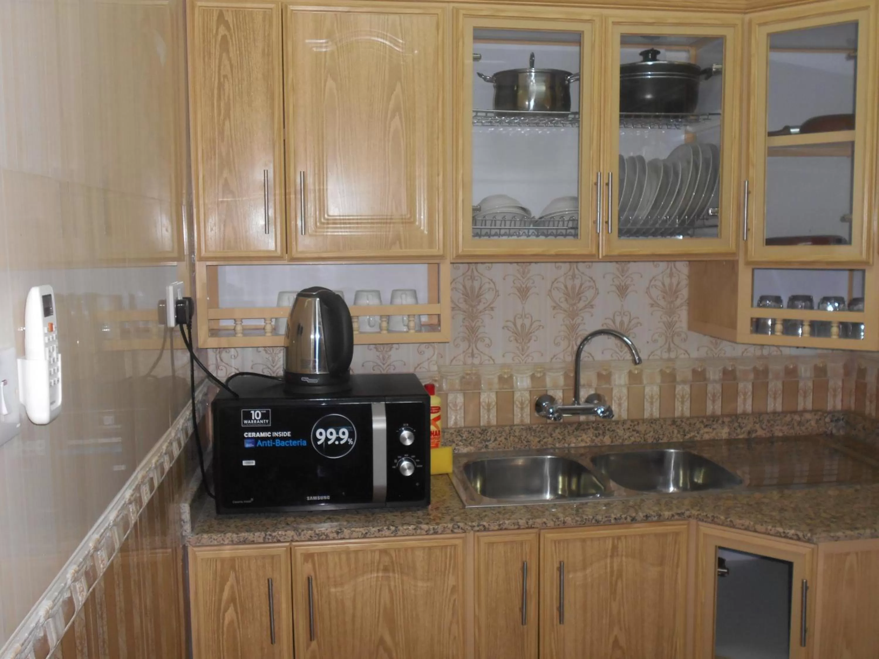 Kitchen or kitchenette in Nizwa Hotel Apartments