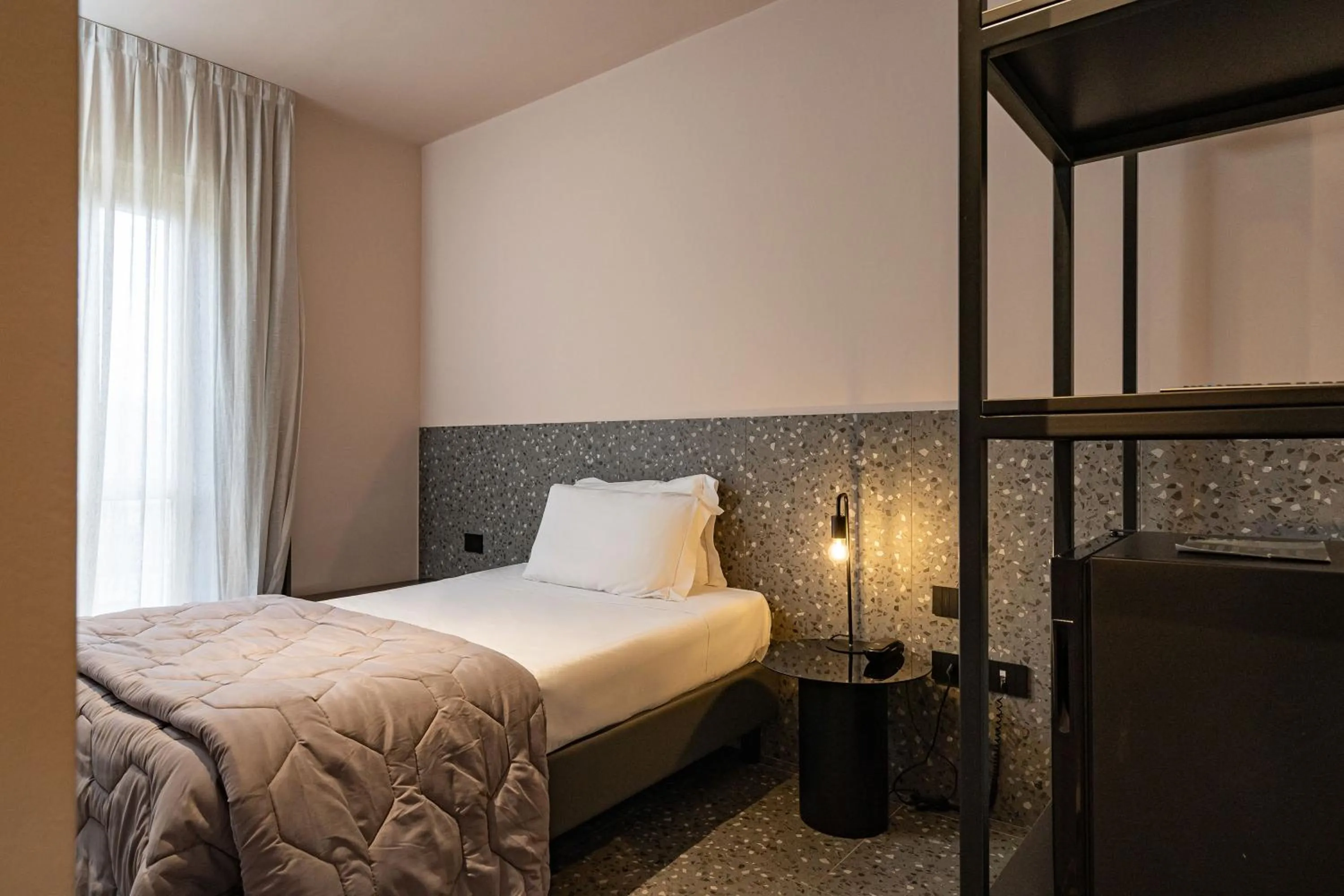 Bed in Elide Design Hotel