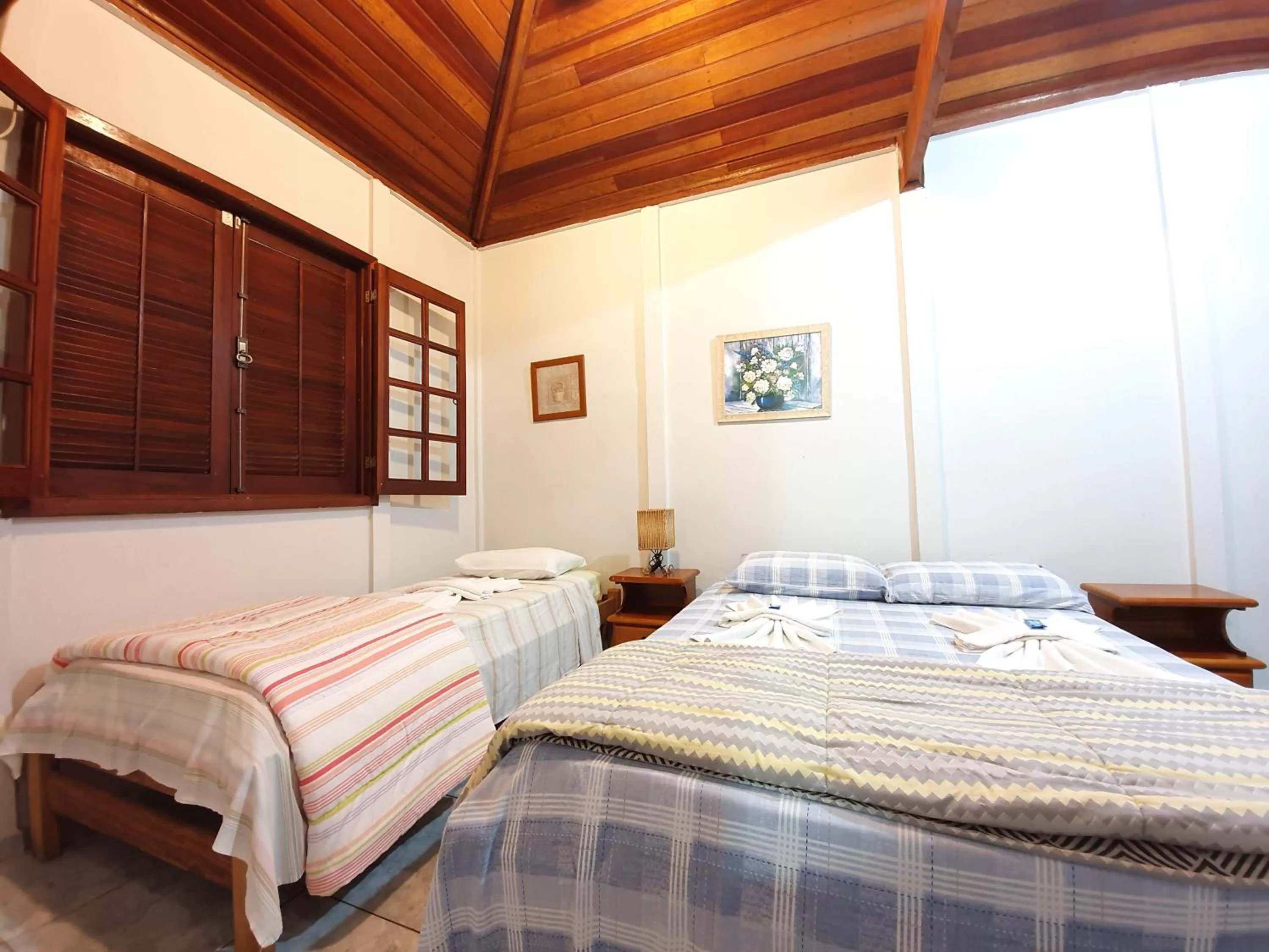 Bed in Pousada Canto do Curió Paraty