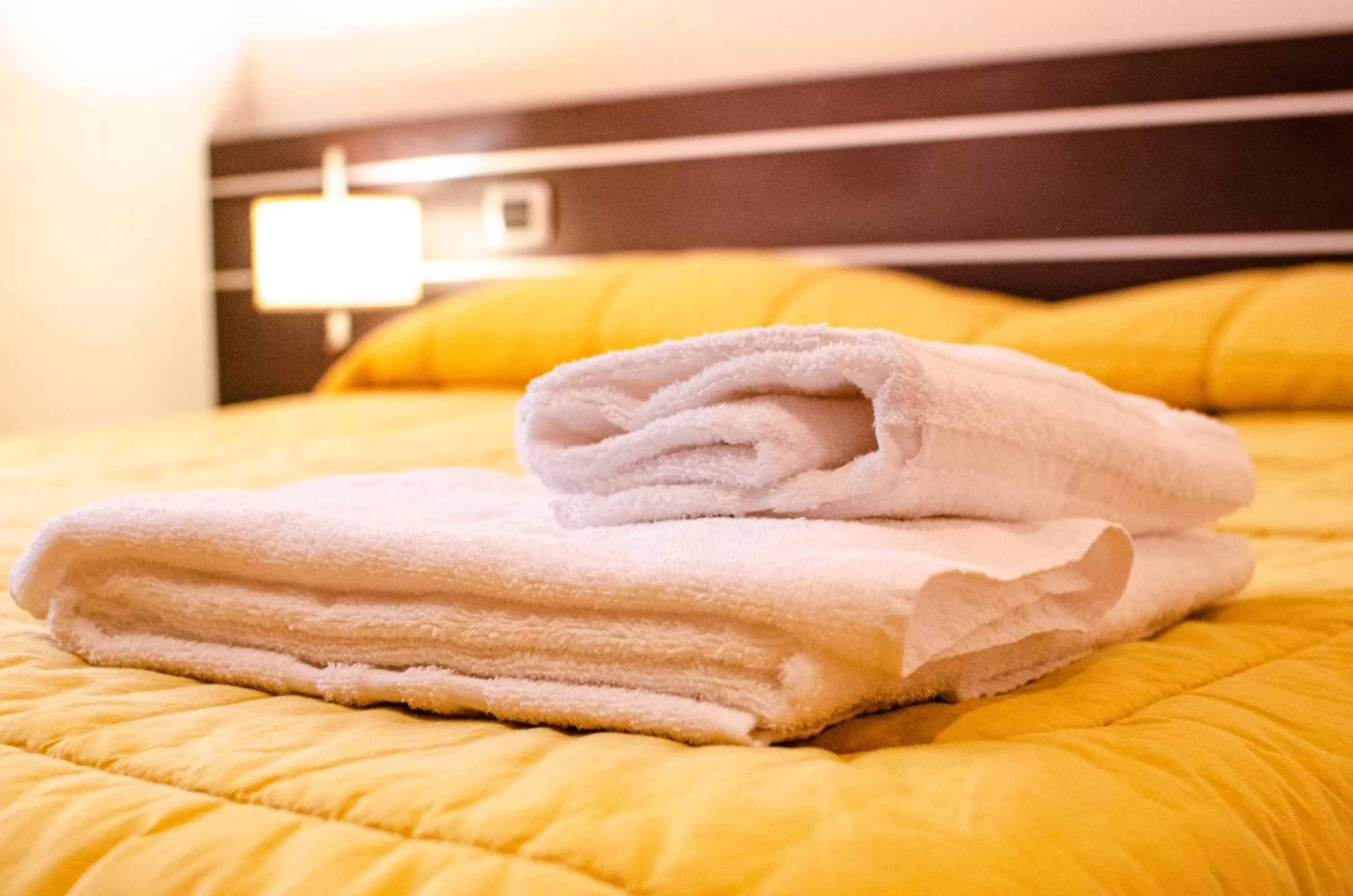 Bed in Al Fogolâr Rooms & Osteria with Saunaland