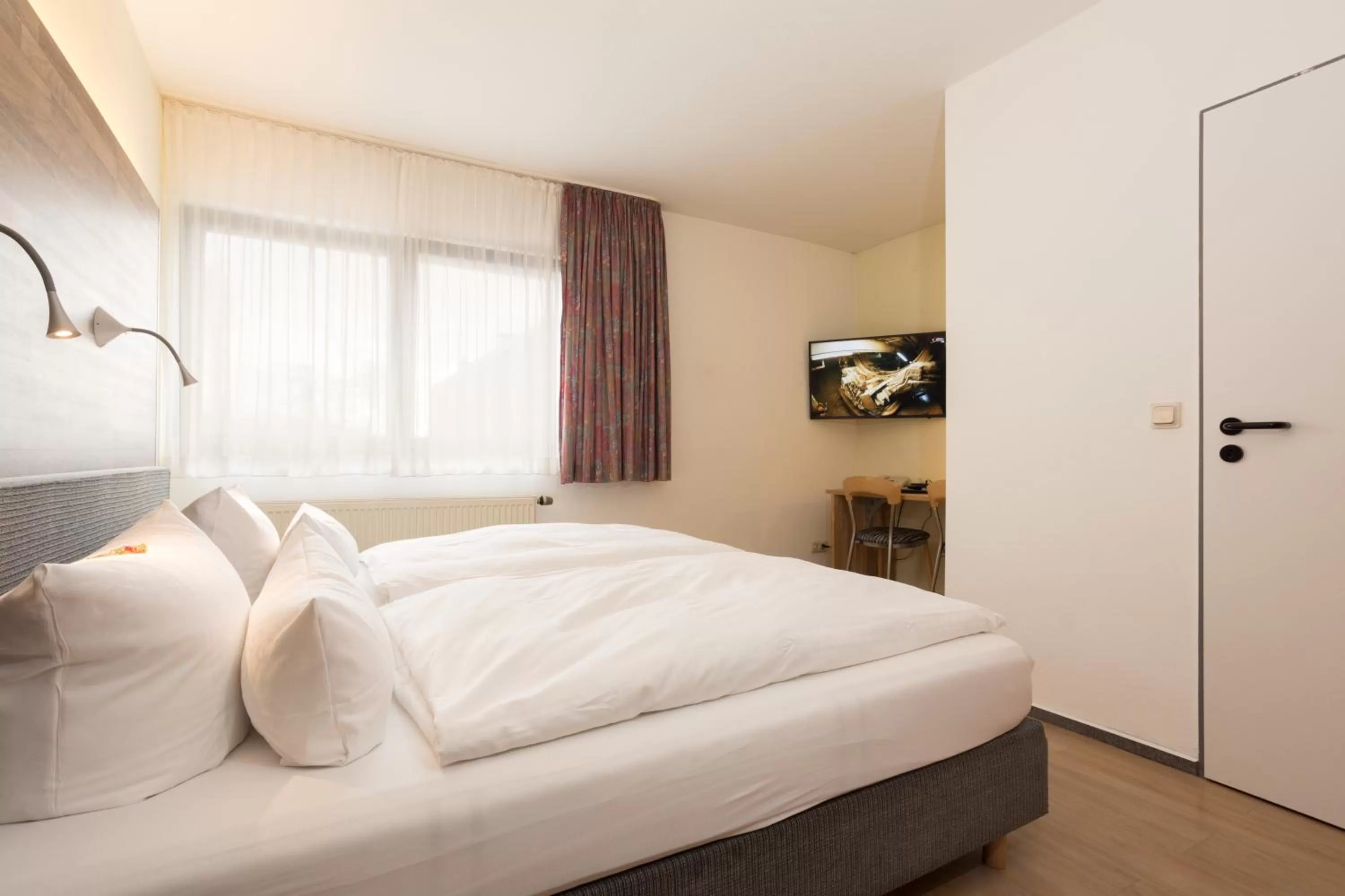 Photo of the whole room, Bed in Hotel & Wirtshaus Hansen