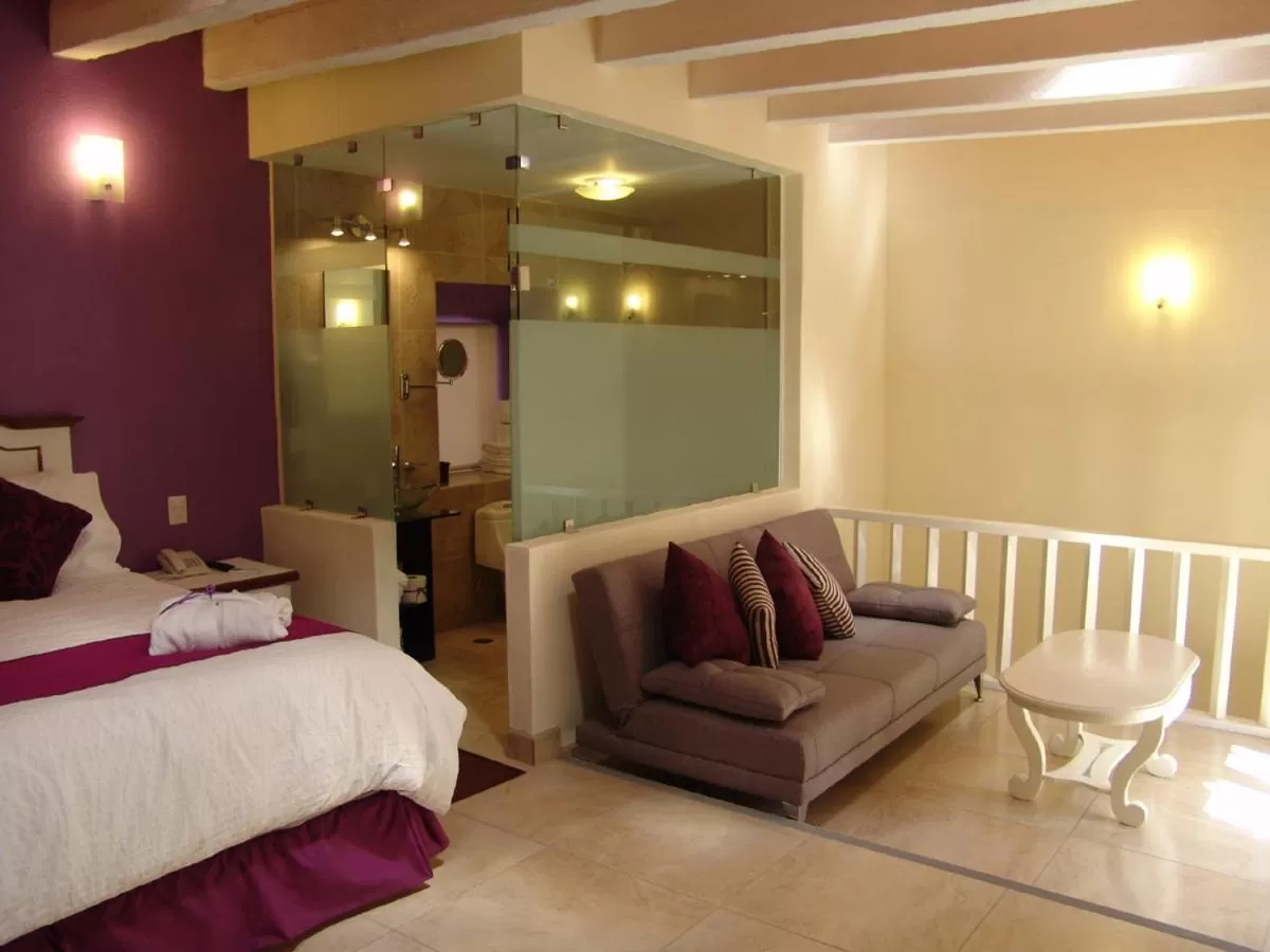 Seating area, Bed in Casa del Tio Hotel Boutique