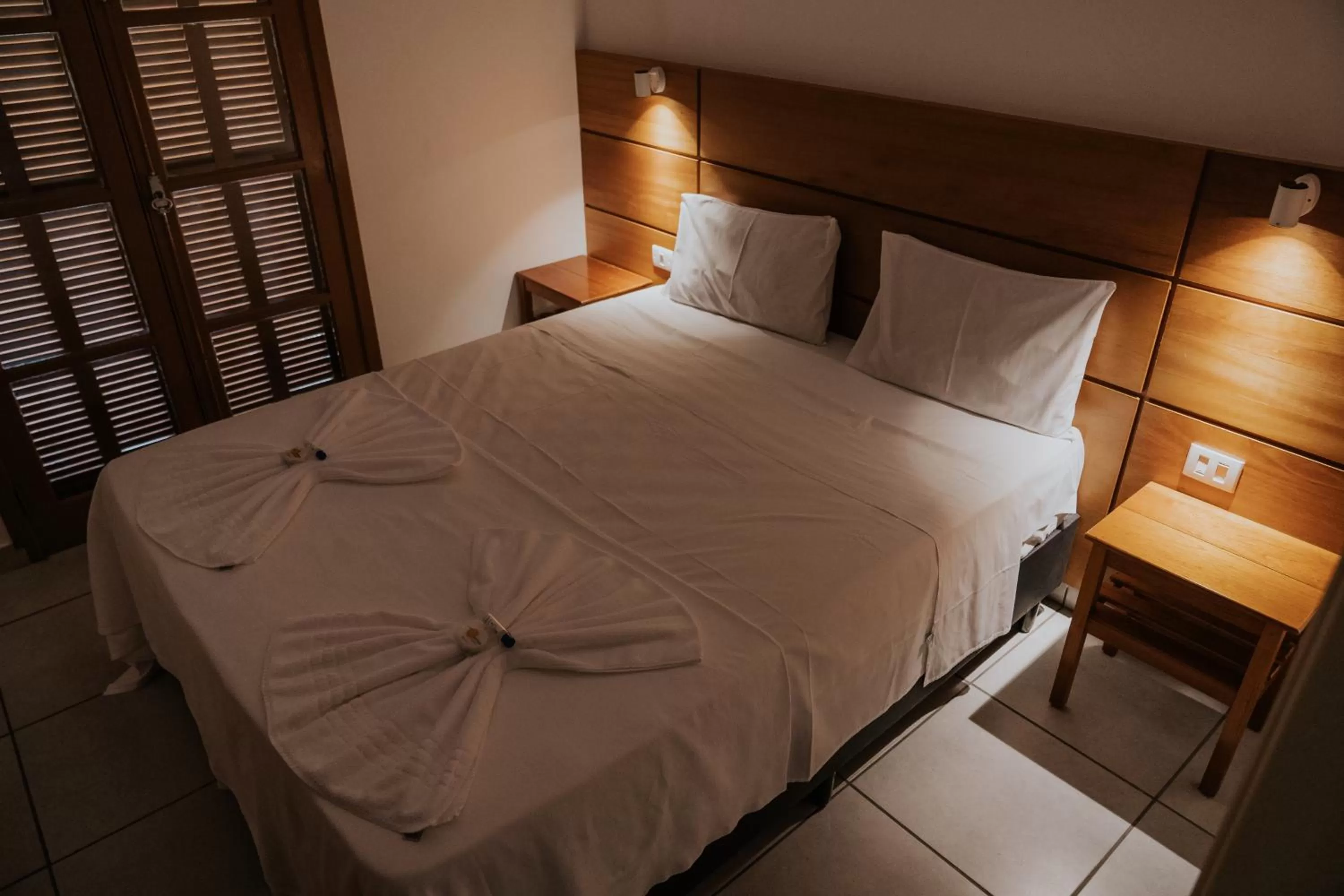 Bed in Pousada Ilha Vitoria